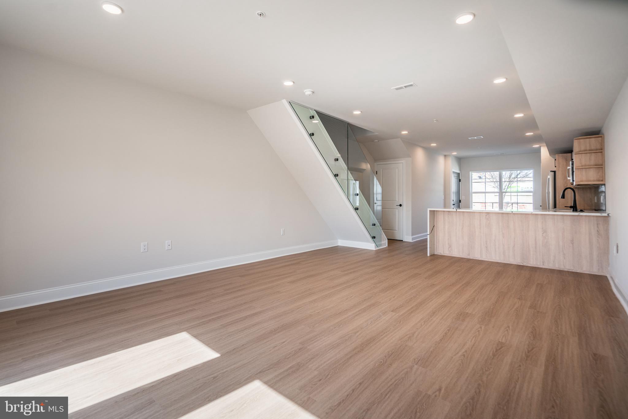 *HOMEBUYER LOAN PROGRAM OFFERING 100% FINANCING, $5,000 LENDER CREDIT AND NO PMI.* Welcome to your dream home nestled in the private community of Wynnefield Heights Square. This chic residence boasts 2 spacious bedrooms and 2 modern bathrooms, all enveloped in the comfort of an energy-efficient HVAC system. Step inside to find a meticulously crafted kitchen featuring Quartz countertops with a waterfall edge, Stainless steel appliances, and under-cabinet lighting - bringing warmth and functionality to your cooking space. Natural light floods the space, highlighting the thoughtful details like wood baseboard molding, glass railing, and high end vinyl flooring. The cozy patio off the dining room will serve as serene spot for your morning coffee or evening glass of wine. The chic exterior combines brick and standing seam metal on the mansard roof, enhancing the building's charm and curb appeal. Fully approved 10-year tax abatement promises affordability. Assigned outdoor parking is available for $30,000, ensuring your vehicle's security just steps from your door. Available Summer 2026. Your oasis in Wynnefield Heights Square awaits. PHOTOS ARE OF AN IDENTICAL UNIT IN THE DEVELOPMENT.