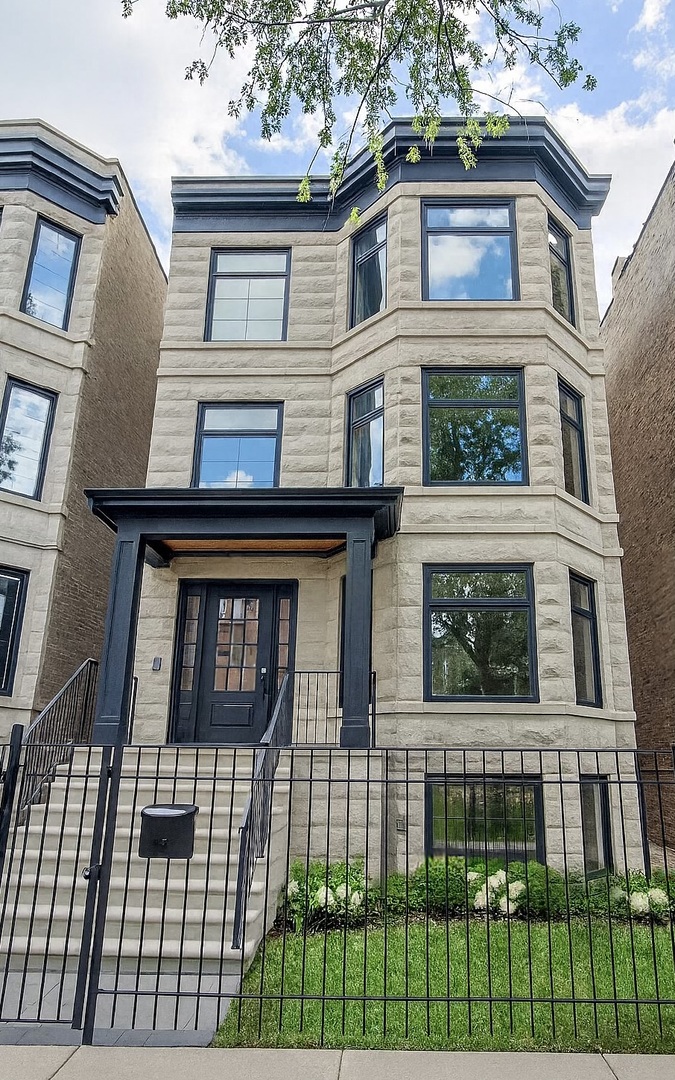 Experience city living at its finest in this remarkable, newly renovated, and expanded luxury residence, featuring 6 bedrooms, 6.5-baths, and 5,400+ SF of refined, professionally designed interiors plus ~2,000 SF of unmatched outdoor space spread across 4 private areas. Situated on a 30' wide lot along picturesque Magnolia Ave, this stunning greystone showcases truly superb craftsmanship and exudes luxury at every turn. Striking facade w/broad limestone steps leads into a beautiful marble foyer complimented by antique mirror, accent panel wall & elegant bronze chandelier. Formal living room sets warm inviting tone w/limestone fireplace framed by built-in floating shelves and flooded w/sunlight through oversized French windows. The heart of home is gourmet kitchen designed w/custom shaker-style cabinetry & paired w/massive Calacatta quartz island, gleaming brass pendants, and top-of-the-line smart Thermador appliances. Perfectly suited for both intimate gatherings and grand-scale entertaining, the open layout flows seamlessly from expansive kitchen and dining into spacious family room adorned w/arched custom built-ins & another fireplace connecting to outdoors for alfresco dining on heated raised patio or garage roof deck for unforgettable gatherings. Second level offers 4 bedrooms/3 baths, including serene primary suite w/balcony, dual walk-in closets, Kohler spa-like bath w/custom white oak vanity, steam & rain shower, floating soaking tub, water closet, and porcelain checkerboard floors. Laundry room completes this level for convenience. Penthouse floor unveils versatile lounge w/kitchenette, wine cellar, and spa-like bath. It opens to a spectacular 800 SF terrace w/sweeping city views. The lower level expands w/2 more bedrooms, 2 full baths, another laundry, media room w/custom built-ins, sleek wet bar, and heated LVT floors -perfect for guests or in-law/au pair living. Additional highlights include white oak flooring across three levels, all radiant heated baths, full smart-home AV automation w/intercom/surround sound & security system w/cameras, snow-melt on front steps & patio, and a newly built brick 3-car garage w/dual EV chargers. Situated in coveted Blaine School District, steps from Southport Corridor dining, boutiques, cafes & iconic Wrigley Field. This exceptional-quality home in stellar location is a rare offering poised to preserve and grow its value for generations to come.