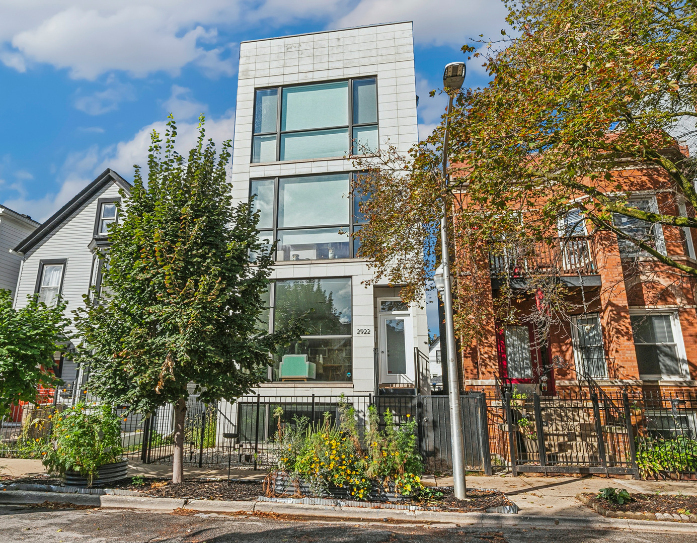 OPEN HOUSES CANCELLED! Feast your eyes on this bright and modern 3Br/2.5Ba duplex featuring open and airy living with timeless finishes throughout. The living room boasts soaring 11-foot ceilings and floor-to-ceiling windows that flood the space with natural light. Sleek, newly refinished hardwood floors and fresh paint provide a seamless, move-in-ready backdrop. The chef's kitchen features a pantry, Bosch appliances, custom flat panel cabinets, and quartz countertops - enduring style that blends modern convenience with classic appeal. The primary suite is amply sized with an organized walk-in closet, and offers a true retreat with heated tile flooring, a large steam shower, and a freestanding soaking tub for a spa-like experience. The lower level offers a large family room with wet bar, two generous guest bedrooms, plus a second full bath and laundry room. Enjoy thoughtful touches throughout, abundant storage, and a 1.5-car garage offering both parking and additional storage space. The private garage roof deck was refinished in summer 2024, is perfect for entertaining or relaxing outdoors especially in Chicago's warmer months. Located in prime Logan Square, this home is incredibly walkable and accessible to everything the neighborhood has to offer - endless restaurants, coffee shops, boutique shopping, and entertainment as well as the California Blue Line station.