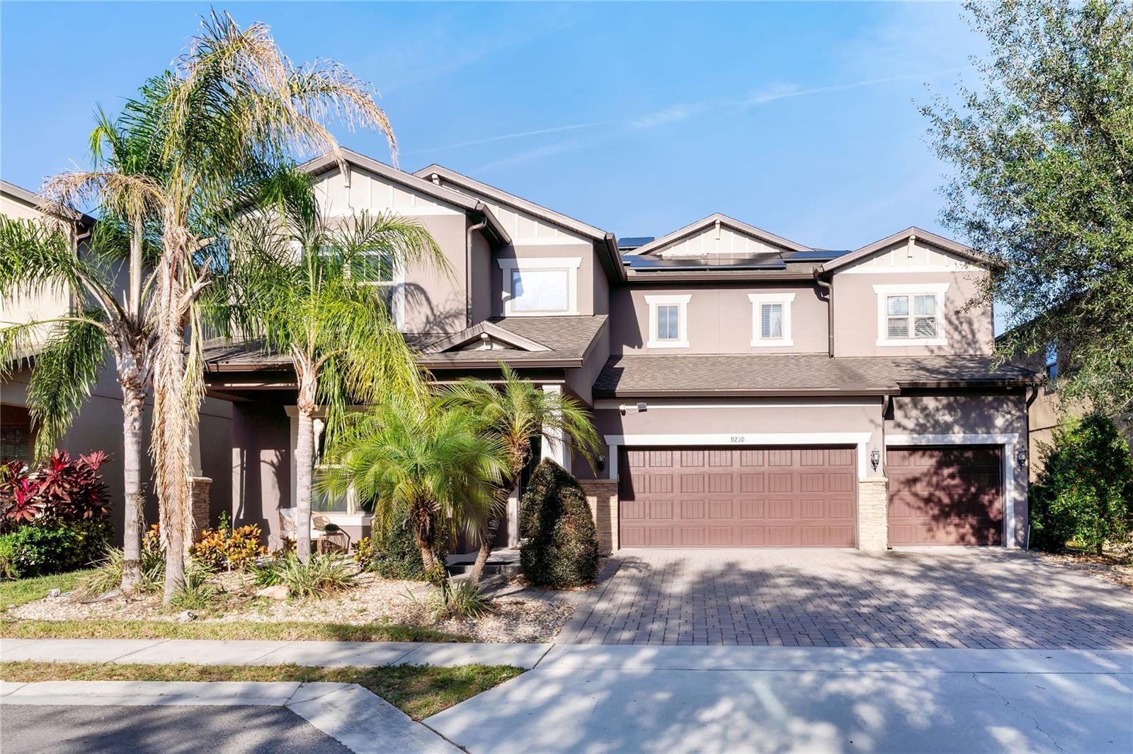 Stunning contemporary 2-story home in the sought-after Royal Legacy Estates — often described as “Disney World’s back door.” Built in 2018, fully furnished, this immaculate residence offers 4,232 sq ft of living space, with 4 bedrooms, 4 full bathrooms, and plenty of upscale finishes. Inside, the home features an open floor plan with high ceilings, coffered ceilings, built-in details, and a bright, spacious layout. The main floor includes a living room with an electric fireplace, a formal dining room, a separate den/office and a bonus room, a mudroom and a large storage under the stair. The gourmet kitchen is equipped with stainless appliances, granite or quartz counters, a cooktop, and ample cabinet space — flowing seamlessly into the great room and dining area. Upstairs, the primary suite is a true retreat: a private area with dual walk-in closets, a separate soaking tub and glass-enclosed shower, and a cozy nook for relaxation or reading. The additional three bedrooms are comfortably sized and share well-appointed bathrooms. One of them is a suite with a walking closet with direct views of Disney’s nightly fireworks. The are multiple storage areas located throughout this floor.Outdoors, enjoy a heated pool and spa, enclosed under a screen cage overlooking a serene pond — perfect for relaxing, entertaining, or enjoying Florida weather year-round. A large covered lanai and deck surround the pool, offering outdoor living appeal. The home also includes a 3-car attached garage, a private elevator (rare in single-family homes), and a landscaped. The house is equipped with a salt water filtration system.Located within a community with shared recreation amenities, and a well-maintained neighborhood. Typical of homes in this enclave, it offers a luxury-lifestyle feel — yet remains family friendly, near top-rated schools like Castleview Elementary School, Horizon West Middle School and Windermere High School.