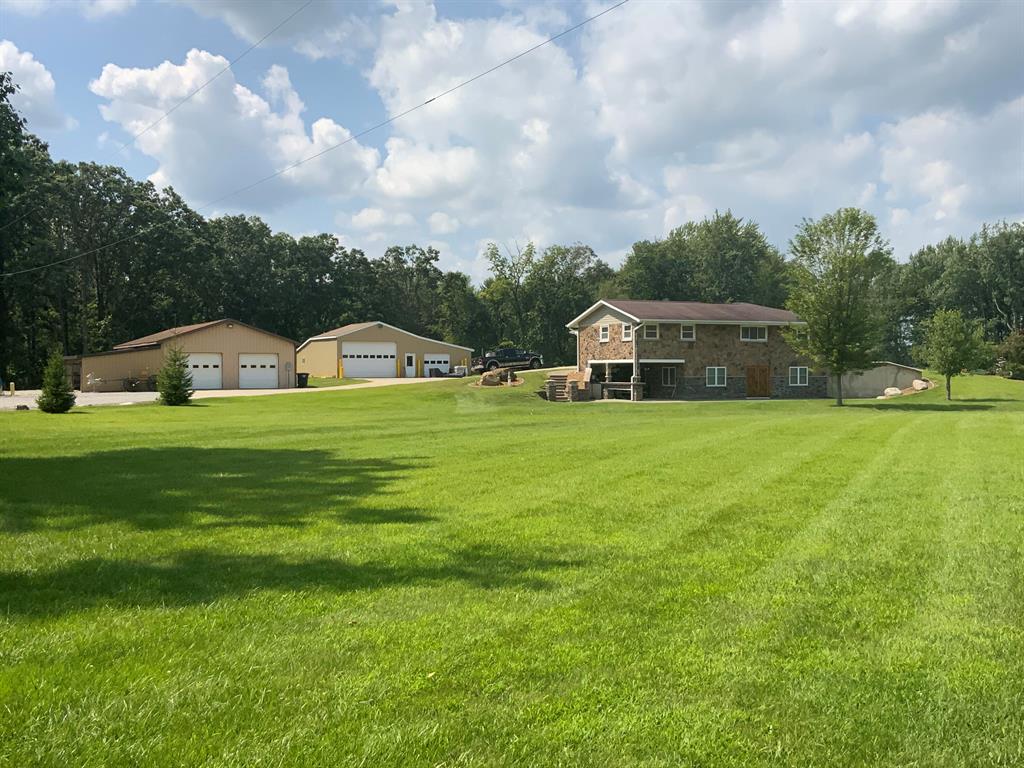 18 acre paradise! This magnificent property offers something for everyone. 3 bedroom(possibly 4), 3 bathroom home with a finished basement, amazing decor and more space than you can imagine. Main floor kitchen is custom made with stone-like counter-tops and solid oak cabinets. Exquisite master bath has walnut cabinets. Walkout bsmt has 2nd fully equipped kitchen, fully functional media room, family room with fireplace, bath, bonus rm.  Outdoor cooking area with shade and room to entertain from the walkout basement, deck, 100yd shooting range, huge yard, beautiful landscaping, wooded, wildlife and pond. It has a spray-foam insulated and  heated pole barn with water, electric, bathroom, I-beam hoist, and air. An uninsulated barn with multiple overhead doors, lean-to, outdoor concrete approaches, electric and air. This property is great for hunting, riding, walking or just enjoying the great outdoors. You can't miss the amazing master bathroom. Other surprises you have to see to believe!3 types of heating: Boiler heat with 5 zones; propane gas forced air; outdoor wood burner with one year seasoned wood included.
ALL FLOORS INCLUDING BASEMENT ARE HEATED!
Surround sound in media room and master bedroom.