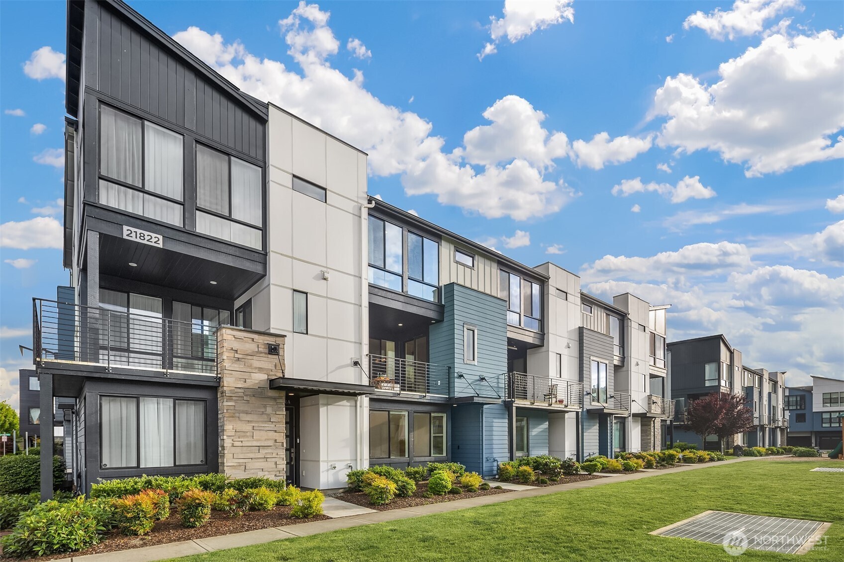 Experience modern living in luxury community w/contemporary architecture & exceptional finishes. This stunning 4BR/3BA residence, ideally situated w/views of central park. Floor-to-ceiling windows & Toll Brothers signature 9 ft’ ceilings flood the home w/natural light. Open-concept main floor showcases chef's kitchen w/abundant cabinetry, large island & SS appliances, flowing to dining area & spacious living room w/cozy gas fireplace & covered balcony w/gas hookup. Primary suite features spa-like shower & walk-in closet. 2 additional bedrooms & hallway bath complete upper level. Guest bedroom w/en-suite bath & 2-car garage w/EV charger on lower level. A/C included! Coveted Northshore SD. Excellent commuter access. Close to all amenities.