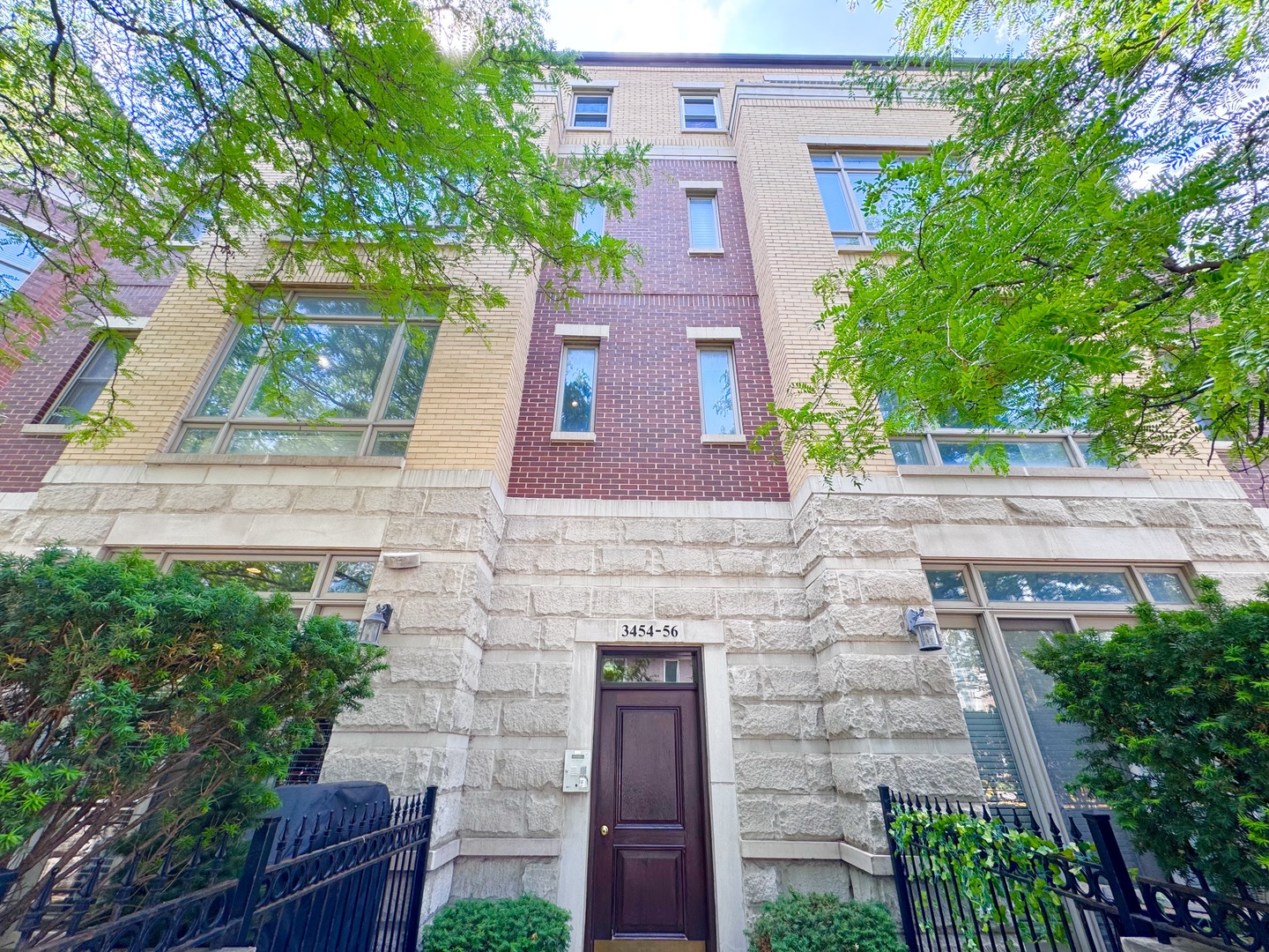 Freshly painted! Top floor 2 bed/2 bath unit in the highly sought-after Southport Corridor. Enjoy abundant natural light pouring in through vaulted ceilings, skylights, and expansive wrap-around windows with south and east exposure. Open floorplan with hardwood flooring throughout. Cozy fireplace adds warmth and ambiance to the living space. Gourmet kitchen features eat-in kitchen with island, granite counters, newer stainless steel appliances, and ample storage make meal prep a breeze. Triple outdoor spaces: enjoy breathtaking views from the balcony off the living room, wide rear deck, and massive 800 sq ft freshly-stained private roof deck perfect for summer entertaining. Large bedrooms. In-unit laundry for added convenience. Conveniently located: close to Paulina Brown Line, Wrigley Field, Whole Foods, Target, parks, restaurants, and entertainment. Garage parking and additional storage included.