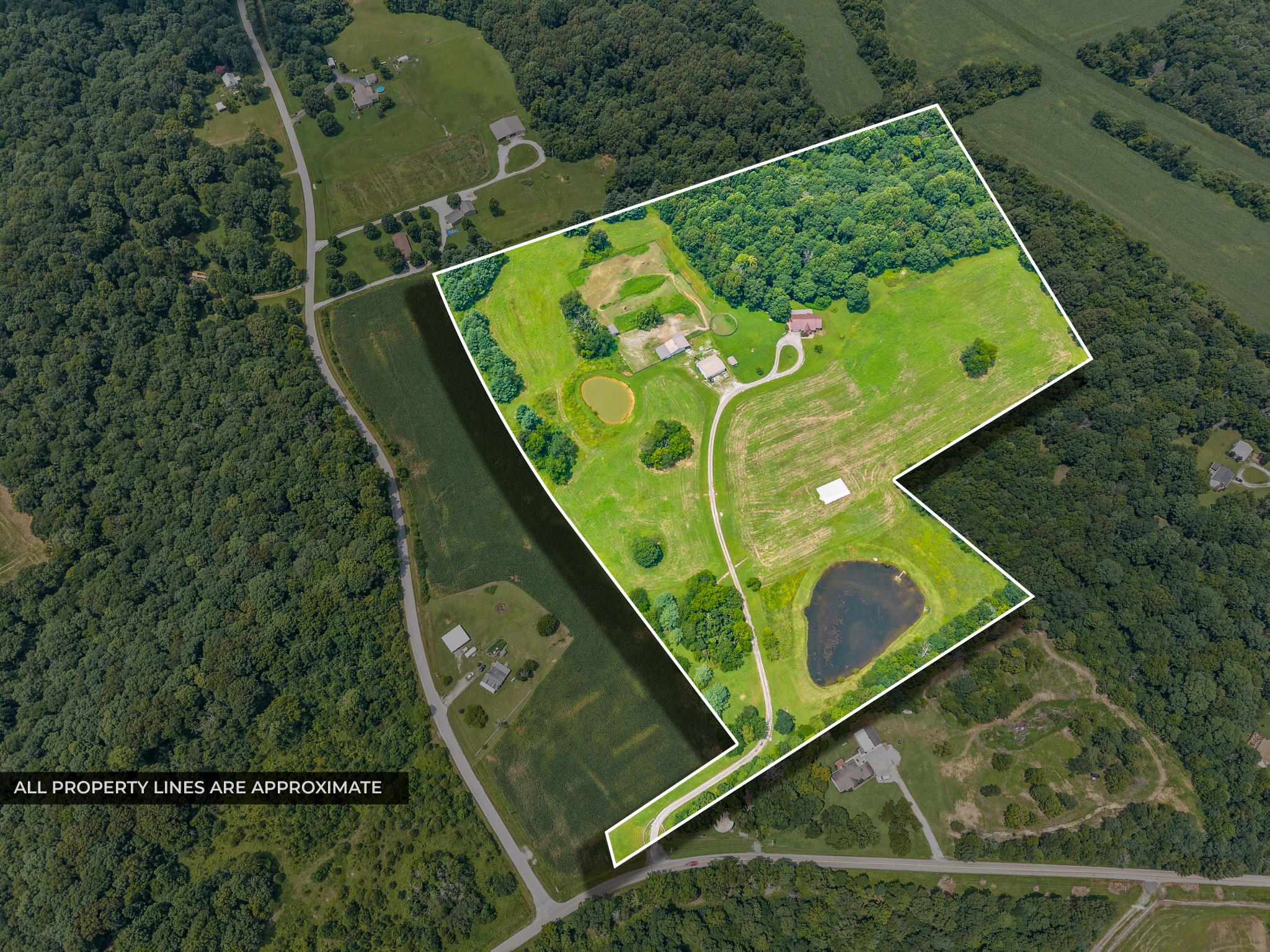 PRICE IMPROVEMENT!! Discover the perfect balance of privacy, recreation, and everyday comfort on 34.83 breathtaking acres. Tucked well off the road, this custom brick ranch offers over 3,100 square feet, 4 bedrooms, 3.5 baths, and the kind of space and natural beauty that's becoming increasingly difficult to find.With more than 20 acres of cropland, two stocked ponds, abundant wildlife, and a scenic walking trail winding through the woods, this property offers a rare combination of recreation, beauty, and everyday livability. Spend your evenings fishing from the dock, watching wildlife from the full-length covered deck, or entertaining on the covered patio while taking in the surrounding views.Designed for both comfort and function, the spacious kitchen features pull-out pantry shelving, abundant cabinetry, and flows effortlessly into the main living areas. The primary suite opens directly onto the full-length covered deck and includes a walk-in closet and relaxing jetted tub. The finished walkout basement expands your living space with an additional bedroom, large gathering area, full bath, and generous storage.The full-length covered patio below creates yet another inviting outdoor living space overlooking the property, while the outdoor kitchen and smoker make entertaining a breeze. Beyond the home, a 32' x 48' heated and cooled workshop with a full bath, concrete floors, electricity, and a 12-foot overhang is ideal for hobbies, equipment, or a home business. Horse enthusiasts will appreciate the four-stall barn and open pastures, adding even more versatility to this exceptional property.Additional highlights include a metal roof (2020) and approximately 8-year-old HVAC. Whether you're dreaming of a farm, recreational property, horse estate, or simply room to breathe, this extraordinary property offers a lifestyle few homes can match.