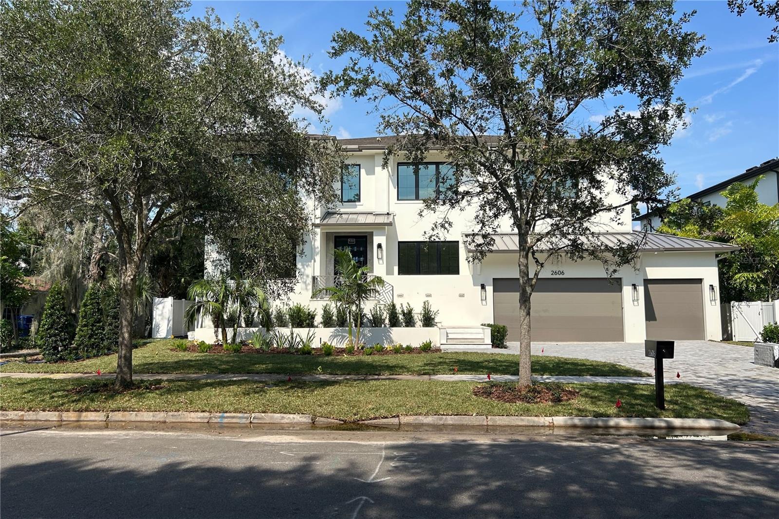 Under Construction. WILL BE COMPLETED BY 9/30/2025! Located in the prestigious Sunset Park neighborhood of South Tampa, this luxury residence is a masterclass in architectural integrity, designer finishes, and state-of-the-art construction.  Built to withstand the elements with first and second floor solid block construction, steel-reinforced stem walls and PGT rated impact windows, this home has been engineered to exceed 150 MPH wind load standards offering exceptional structural integrity and peace of mind. A full-home generator, vapor-sealed concrete foundation, and Icynene foam insulation ensure year-round comfort and uninterrupted performance in any condition. Across every inch of this residence, the attention to detail is undeniable. The professionally designed exterior features a paver driveway, slick stucco finish, 30-year dimensional shingle roof, bronze gutters, and a marble-clad front porch. Inside, 10ft to 10ft 8in ceilings, 7.25in baseboards, oak tread staircase, level 5 drywall finishes, and single-panel 8ft solid core doors create an atmosphere of timeless elegance. Engineered hardwood floors run throughout the living spaces, complemented by coffered ceilings. The open-concept floor plan is anchored by a stunning designer kitchen with full custom cabinetry, level 6 quartz counters, full-height quartz backsplash, pot filler, and professional Thermador appliance package including 30” refrigerator and freezer towers, 36” cooktop, double ovens, microwave drawer, and a vented hood. A walk-in butler’s pantry adds function and style with LED-lit white oak floating shelves and dual 24” beverage/wine fridges. Indoor-outdoor living is effortless with a 16’ impact-rated sliding glass door that opens to a marble-clad lanai, complete with an outdoor kitchen that includes marine-grade cabinetry, a 32” Artisan gas grill, beverage fridge, stainless sink & 3 outdoor speakers. The outdoor space is complete with a resort-style pool with spa and sun shelf, perfect for year-round entertaining. A hydraulic elevator offers easy access to the second floor, where you’ll find the expansive primary suite featuring soaring ceilings, a private beverage center, and a spa-caliber en suite bath with dual vanities, designer marble, a soaking garden tub, large walk-in shower, and custom built-in closet system. Each secondary bedroom on this floor also includes a walk-in closet with built-in closet systems and en suite bath, designed with thoughtful finishes and insulation for sound control. A second-floor loft, laundry room, media room, and dedicated AV closet expand the home’s functionality and flexibility. Additional highlights include two Navien tankless gas water heaters, 2 17+ SEER Carrier HVAC systems with 2 programmable Ecobee smart thermostats, Gyp-Crete for fire and sound resistance, and in-wall pest control tubes. The oversized 4-car garage (2-car tandem) features high-lift doors, 16’6” ceilings, and WiFi-enabled openers. This home blends state-of-the-art features with fresh modern elegance. Situated within the Plant High School district and minutes from Tampa’s top dining, shopping, and commuter routes, this is more than a home, it’s an investment in exceptional living.