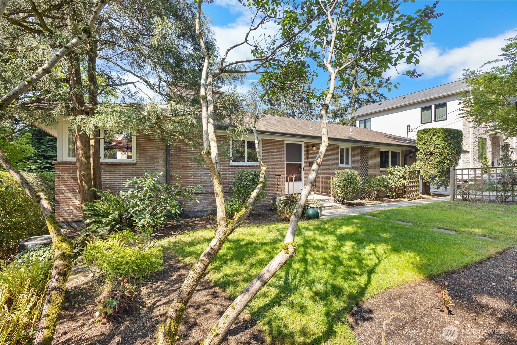 This mid-century classic daylight rambler has peek-a boo lake views! Set in Mercer Island's desirable First Hill neighborhood on the north end, it's just minutes away from the town center and I-90 access to Seattle or Bellevue. Bring your creativity to this spacious layout with newer dual pane vinyl windows, a huge rec room, newer composite deck and original hardwoods. OR build your two story dream home on the sunny, west facing lot and enjoy gorgeous lake views from from the second floor. You'll love the serene, tree-lined street with easy walkability to nearby amenities. Stroll downtown for the summer farmer's market, or walk to First Hill Park for an afternoon outing! Top-rated Mercer Island schools make this a smart investment!