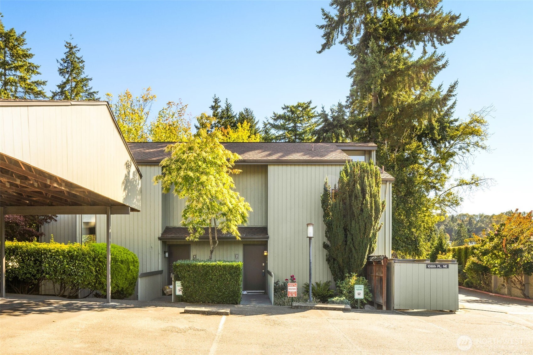 Beautiful PNW Contemporary townhouse in Yarrowood! Nestled in a prime location near Seattle, DT Bellevue, Redmond & Kirkland. This spacious end unit townhome has vaulted ceilings and large windows that offer tons of natural light and views of mature landscaping. The great room features hardwood floors, a wood-burning fireplace and an open floor plan that leads to a beautiful private patio, perfect for enjoying PNW evenings. Upstairs offers 2 bedrooms, full bath, and a laundry room. Just steps from the pool, tennis court & clubhouse. Includes 2 parking spaces, extra storage, and no rental cap!