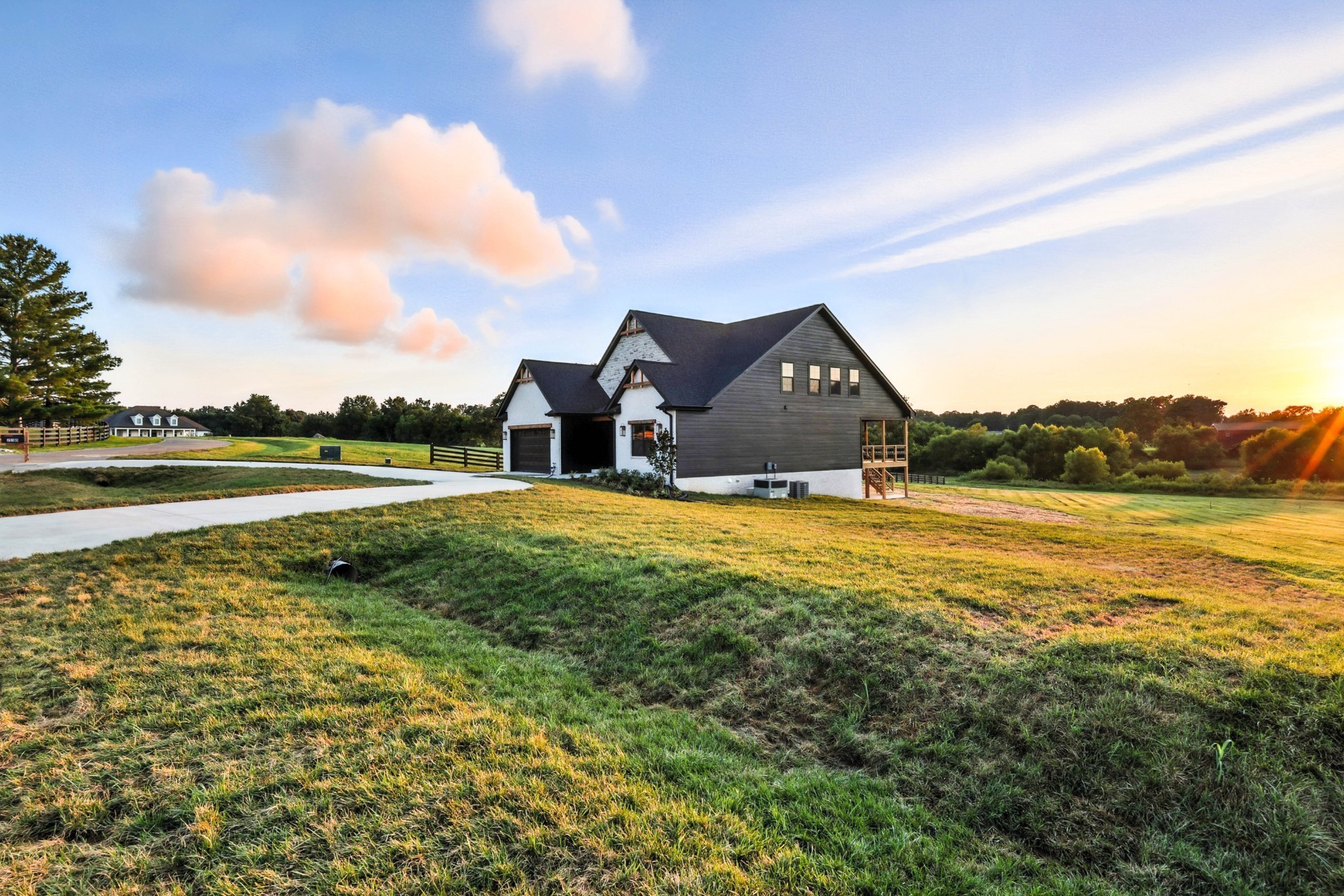 Offering $24,000 in concessions! With preferred lender even more money to concessions! Welcome to Port Royal Farms! NO HOA! This is the last house to be built on this road and you’ll have no backyard neighbors! Just peace and quiet. When you think of a custom house- this is it! Located directly across a top tier equestrian, so horses at your front porch view and sunsets on your back deck. Don’t worry, there isn’t a smell or flies! This home is constructed only with brick, stone, and hardboard- zero vinyl on the exterior. This home is 4 bedrooms with three and a half bathrooms along with an enormous bonus with which has the half bath in it. The kitchen is a true chefs kitchen! Monogram appliances to include a $12,000 48” gas top Monogram oven. The walk in pantry has a “Costco Door” that allows you to back your vehicle into the garage and unload your items directly into the pantry. Other upgrades: under cabinet lighting, tankless water heater, custom wooden shelving in every closet, hardwood stairs, circular driveway for all the entertaining, encapsulated crawlspace with dehumidifier, hot and cold water spigots outside, concrete pad under back deck for any type of storage, American Standard HVAC system, professional grade surveillance system on the exterior, spray foam insulation, cedar tongue and groove ceiling on porch and deck, and so much more! This home is a must see in person as pictures do not do it justice. Did I mention the builder meets the clients? Pool or a permanent structure CAN go in due to the strategic placement of the septic system. Don’t like the blue accent walls? We can change that. Located 10 minutes to exit 11 and 30 minutes to Nashville. Call Lauren with any questions- 9315618579.