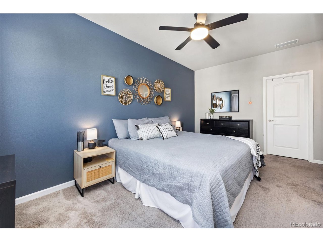 Not all townhomes are created equal, and this one raises the bar. Soaring ceilings, oversized living spaces, and an incredible floor plan make this home feel more like a single-family home than a traditional townhome.The main level delivers the "wow" factor. The open great room seamlessly connects the kitchen, dining area, and living room in a way that feels spacious and functional. The kitchen features crisp white cabinetry, gray quartz countertops, and plenty of prep space, while the private patio extends your living space outdoors-perfect for morning coffee, evening relaxation, or taking in the mountain views.Upstairs, the primary suite offers dual closets, a five-piece bath, and access to the upper patio. A second bedroom, full bath, and conveniently located upstairs laundry complete the upper level.The entry level adds flexibility with a welcoming foyer, custom stenciled landing, half bath, utility room, and an attached two-car garage that actually fits two vehicles.Location separates this one from the others.  Set on a quiet grassy courtyard away from road noise, this is one of the most desirable locations within the community. Enjoy added privacy, beautiful surroundings, and easy access to the pool and playground.If you've been searching for the convenience of low-maintenance living without compromising on space, this is the one. This is the kind of home that simply feels right the moment you walk through the door.