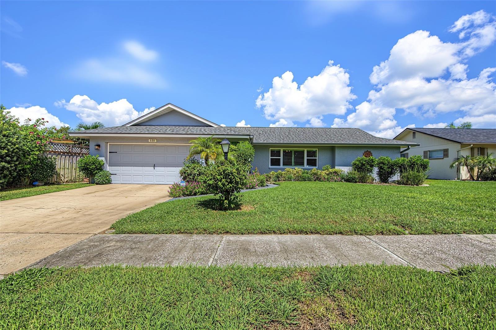 Charming, beautifully maintained, and move-in ready! This adorable 2-bedroom, 2-bath, 2-car garage home is ideally located in the highly desirable city of Palm Harbor. Thoughtfully cared for and filled with natural light, this inviting home features new hurricane-rated windows, new blinds, a newer roof, and beautiful luxury vinyl flooring throughout. The spacious interior offers a welcoming formal living room and dining room, plus a convenient dinette area just off the kitchen. The well-appointed kitchen features stainless steel appliances and beautiful stone countertops, opening to a generous family room with serene views of the fully fenced backyard. Step outside to the covered and screened-in lanai, the perfect spot to relax, entertain, or enjoy Florida’s beautiful year-round weather. Additional highlights include an inside laundry room, abundant natural light, spacious two-car garage, and a private fenced backyard. Ideally situated close to shopping, dining, parks, beaches, and all that Palm Harbor has to offer, this delightful home combines comfort, style, and an exceptional location!