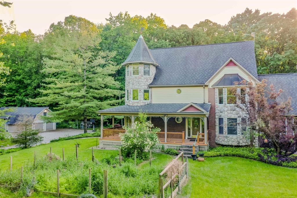 Stunning custom built Victorian home built with stone, cedar and brick on an exceptional 10.5 wooded acres with all the privacy of country setting! Still close to everything you need and do. Great floor plan with grand foyer leading to an incredible and unique custom kitchen with wood ceiling, huge granite island, deep stone sink & custom frig. The great room boasts soaring vaulted ceilings & tons of natural light, Beautiful flooring, Elevated deck, large finished walkout basement w/full kitchen & full bathroom and guest bedroom, whole house generator, central vac, multiple fireplaces, too many features to name! Fantastic upper terrace pond view! 2 Pole barns, 1st ( 30 x 48 ) has 14 x 12 role-up door. The other can store motorhomes, boats, fifth wheel trailers and much more. Master bathroom with deluxe steam shower. Formal dining room with sink & 2nd dishwasher. Solid wood doors & crown molding through. Surrounded by acres of woods. Come and enjoy the view!