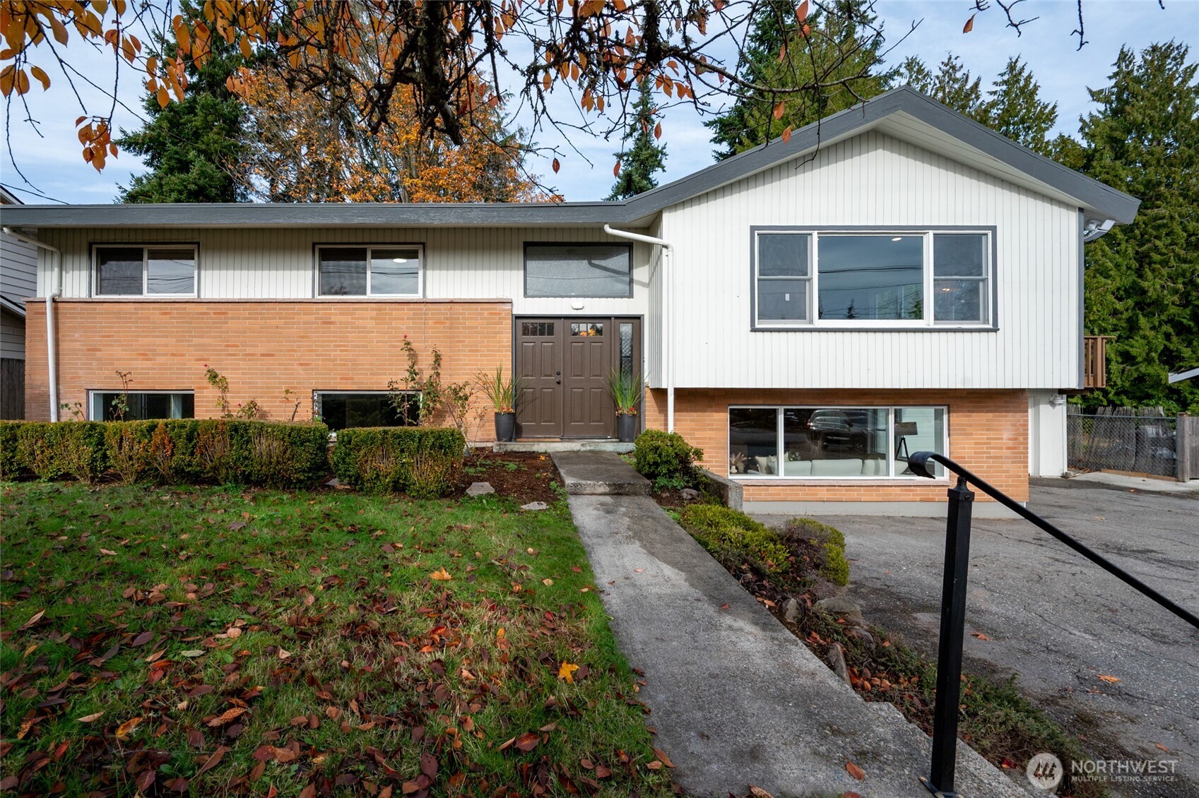 Updated, Spacious, Mid-Century home on a large lot across from Albert Einstein MS and Hillwood Park. Upper floor has beautifully updated kitchen and baths with new cabinets, Carrera quartz counters, glass enclosures, fresh paint, and high-end engineered flooring. Downstairs includes a 5th bedroom/den with en-suite bath, rec room "plus bonus room", generous laundry room, and a generous unfinished shop/utility room. Flexible floor plan with plenty of room for home office and an ADU. Huge driveway w/6+ off-street parking, 2-car attached garage and RV/Boat! All work permitted. Enjoy proximity to shopping, dining, parks, Lt rail and top-rated schools.