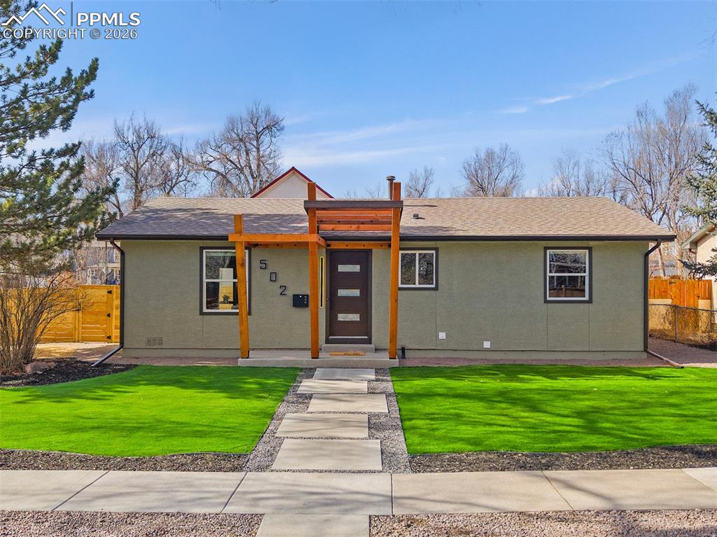 Set in a charming downtown Colorado Springs neighborhood just half a mile from the heart of the city, this open concept, completely remodeled two-bedroom, two-bath home offers a rare blend of modern living and walkable, small-town charm. Positioned on a corner lot, the home feels open and inviting from the moment you arrive.A newly xeriscaped front yard and oversized, staggered concrete pathway lead to a front patio framed by a brand-new custom pergola-a relaxing spot for morning coffee. As you step inside, the home opens into a beautifully open living space with vaulted ceilings where the living room, dining area, and kitchen flow together seamlessly.The kitchen has been fully updated with new cabinetry, quartz countertops, and an oversized island with a waterfall edge that anchors the space. Brand-new LG appliances and a luxury faucet complete a kitchen designed for both everyday living and easy entertaining. New LVP flooring runs throughout the main living areas, with newly carpeted bedrooms adding warmth and comfort.Both bathrooms have been completely updated with clean, modern finishes. The primary bedroom functions as a true suite -a rare downtown feature- offering a private bathroom with a glass-enclosed shower, tile extending to the ceiling, and a floating vanity. The secondary bathroom features a new tub and shower, modern vanity, and a smart anti-fog mirror.The oversized backyard has been leveled and enclosed with a brand-new privacy fence, offering a blank canvas ready for gardens, outdoor dining, or a personal retreat. A detached shed adds additional storage.Located less than half a mile from downtown, this home places you just a two minute walk from Shooks Run, and a 4 minute drive to Bird Tree Café, local coffee shops, a neighborhood pizzeria & all that downtown Colorado Springs has to offer-while still feeling rooted in a quiet, established neighborhood.Completely remodeled. Thoughtfully designed. And rarely found this close to downtown.