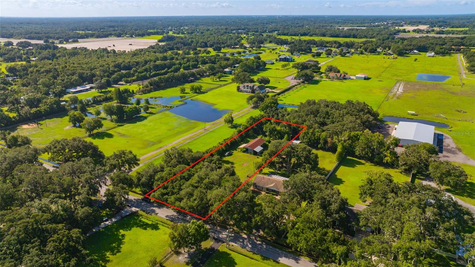 Discover the possibilities at 5701 Miley Road in Plant City! This beautiful property offers a peaceful country setting with plenty of space to bring your vision to life. The property is completely fenced in, providing added privacy and security. Surrounded by natural beauty, the property features a pole barn, providing valuable space for equipment, storage, hobbies, or future projects. Whether you’re looking to create your own private retreat, homestead, or build something new, this property offers incredible potential. The existing mobile home is uninhabitable and is being sold as-is with no value attributed to the structure. Come experience the beauty of the land and imagine all that this unique Plant City property could become! Come take a look today!