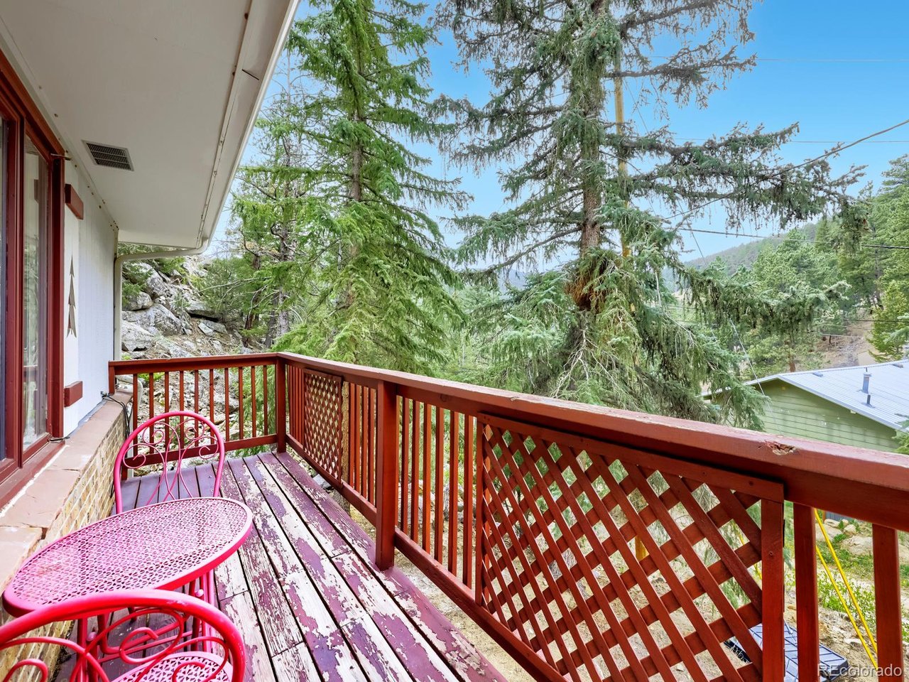 What if your morning commute started with fresh mountain air, towering pines, and the occasional wildlife sighting outside your window? Tucked into the foothills just minutes from Lyons, 21005 State Highway 7 offers the Colorado mountain lifestyle so many buyers dream about but rarely find at this price point. Surrounded by mature pines, national forests, dramatic rock outcroppings, and the natural beauty of the Front Range, this property feels like a private retreat where you can unplug, recharge, and enjoy the outdoors year-round. Whether you're sipping coffee on the deck, exploring nearby trails, watching snowfall settle across the forest, or enjoying quiet evenings beneath a canopy of stars, this is a home that invites you to slow down and embrace everything that makes Colorado special. Inside, large windows bring the outdoors in, creating a warm and inviting space filled with natural light and mountain character. The open living areas provide room to gather with family and friends after a day of hiking, biking, fishing, or exploring Rocky Mountain National Park. A whole-home generator adds peace of mind and ensures comfort through every season. Perfectly positioned along the scenic Highway 7 corridor, you'll enjoy easy access to Lyons, Estes Park, Boulder, and some of Colorado's most celebrated outdoor recreation, while still enjoying the privacy and serenity of mountain living. Whether you're searching for a full-time residence, a weekend getaway, or a place to create lasting memories surrounded by nature, this property offers an opportunity to experience Colorado the way it was meant to be lived. 3rd bedroom is non-conforming. Link to 3D Tour: https://www.zillow.com/view-imx/452026ec-fe95-4936-8e67-5f45c0a5a6ee?setAttribution=mls&wl=true&initialViewType=pano