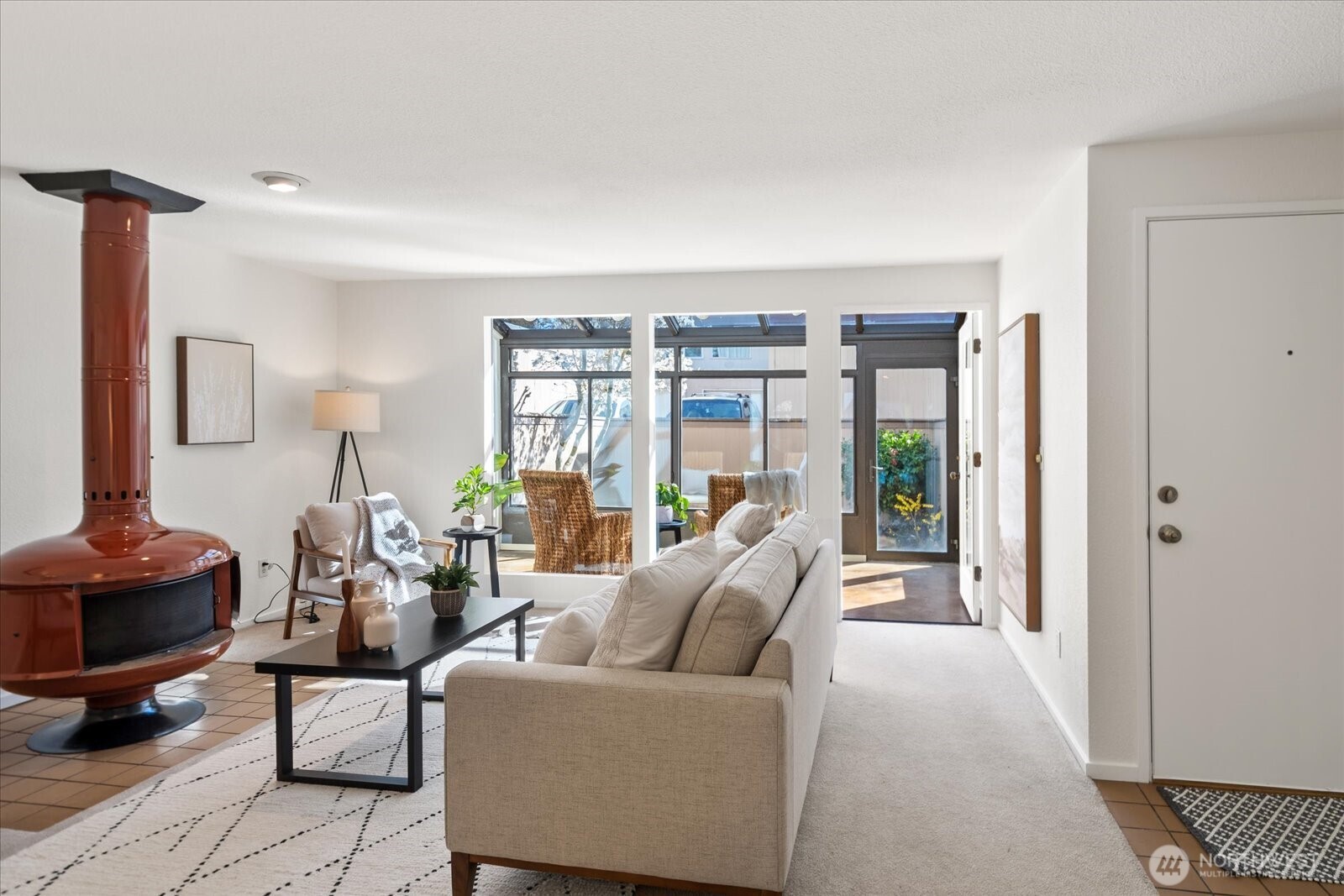Welcome to this spacious Solaire One townhome in Edmonds' popular Five Corners neighborhood! Set off the street in the back of the complex, this bright and inviting 2 bed, 1.5 bath townhome lives like a single family home. Just blocks to popular restaurants, cozy coffee shops, top-rated Edmonds School District schools & Swedish hospital, this location offers the perfect blend of convenience and community. Only a quick five-minute drive West brings you to vibrant downtown Edmonds & the sparkling waterfront. Inside, enjoy a light-filled sunroom with access to a private patio & garden space, a spacious living room, and an open-concept kitchen with adjacent dining area and generous pantry/storage. Main level powder bath adds convenience. Relax or entertain on the fenced back deck—your own serene outdoor retreat! Upstairs features a large primary suite with private balcony, desk nook, and oversized closet. One other large bedroom and full bath, plus in-unit laundry for easy living. One car garage and one assigned parking space. Pets allowed up to  40 lbs. Investor opportunity as it is under the rental cap. Pre-inspected for your peace of mind. Prime commuter location with quick access to freeways, Light Rail, bus lines and Sounder train. Amazing value!