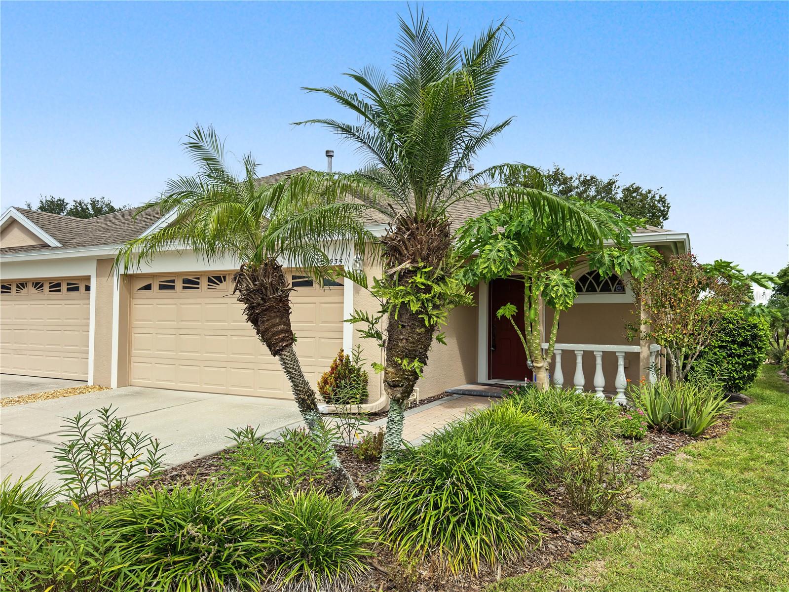 Lock-and-leave living in the gated Whitlock villa community of Meadow Pointe III, surrounded by ponds and protected conservation land. This 3 bed, 2 bath single-story villa sits on a private lot with lush, mature tropical landscaping. The HOA covers the roof, exterior paint, lawn and grounds care, and pest control, so weekends are yours. Inside, ceramic tile runs throughout with no carpet, plus fresh neutral paint, ceiling fans, and a solar tube for natural light. The kitchen features rich wood cabinetry, a gas range, breakfast bar, and eat-in space. The owners suite has new windows (2025). Peace of mind: a new American Standard AC with gas furnace installed in 2025 with a 10-year extended warranty. Relax on the covered, screened lanai overlooking the private backyard. Includes a 2-car garage plus refrigerator, washer, and dryer. Just 3 minutes to the Meadow Pointe III CDD clubhouse with resort-style pool, splash pad, fitness center, tennis, sand volleyball, and playground. Flood Zone X. Minutes to The Shops at Wiregrass, AdventHealth Wesley Chapel, SR 56, and I-75. Schools: Wiregrass Elementary, John Long Middle, Wiregrass Ranch High.