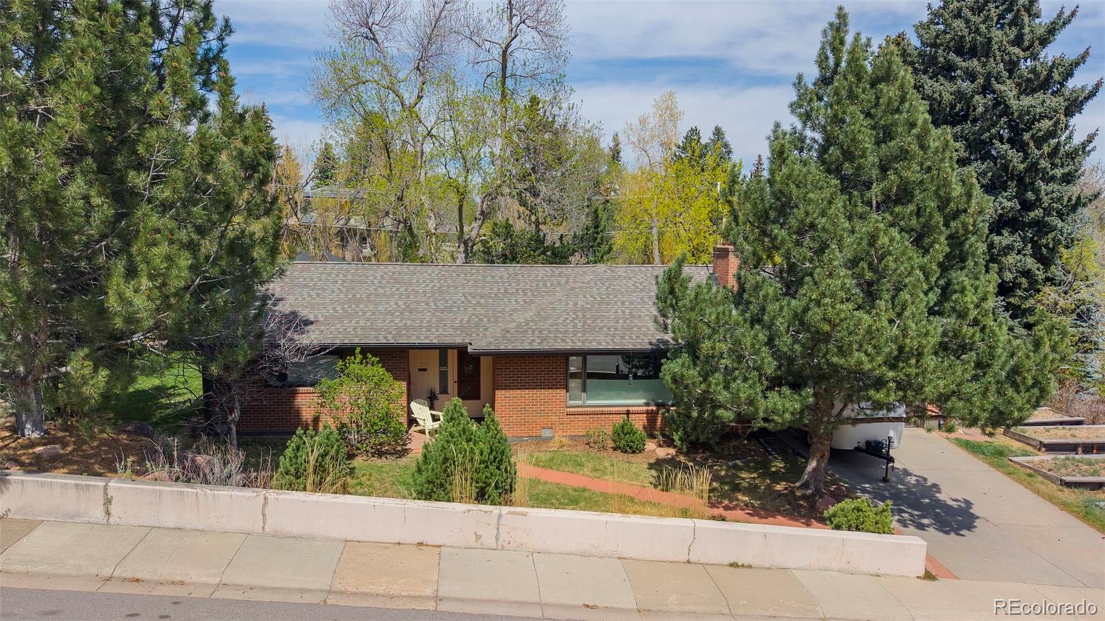 $90,000 Price Reduction! Live in your own private paradise. Ranch-style living at its best-just steps from the McClintock Trailhead leading directly into iconic Chautauqua Park. Set on nearly half an acre, this unique property is framed by a creek along the back, creating a backyard that lives like your own private park-lush, secluded, and incredibly peaceful. Mature landscaping and the natural setting offer a rare sense of privacy and tranquility in one of Boulder's most sought-after locations. The ranch-style layout offers easy, single-level living with a comfortable, welcoming feel. Move right in and enjoy, or bring your vision and elevate the home to match its exceptional setting-an opportunity that doesn't come along often in this location. Ideally situated with easy access to everyday conveniences, downtown Boulder, Denver, and the mountains, this home offers the perfect balance of retreat and connection.