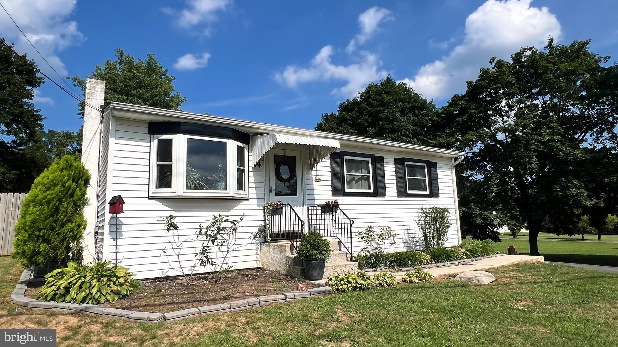 Delightful and deceptively spacious expanded ranch in Warwick Township! This beautifully maintained country home, located in the highly sought-after Owen J. Roberts School District, is staged to impress and available for quick settlement. Brand new septic system just installed! A new well pump was installed in 2025, and the home is equipped with a water treatment system, and a generator hookup with separate electric panel.  New driveway in 2025, two large decks, and raised flower bed. Thoughtfully expanded with a family room and enclosed sunroom, it offers generous living space featuring hardwood floors, an inviting eat-in kitchen, and carpeting in the sunroom. From the welcoming front porch and bay windows, enjoy peaceful views of the surrounding countryside, and peak a boo views of the golf course. Minutes to French Creek State Park, nature reserves and historic Saint Peter's Village.  Multiple ceiling fans help keep the home comfortable year-round. Additional features include a detached 2-car garage with an entry door and the option to add a garage door, a full open basement with Bilco door access, and nearly one acre of level ground with low taxes.  Experience one-floor living at its finest in desirable Chester County! Square footage was updated, it is the buyers responsibility to measure and confirm.