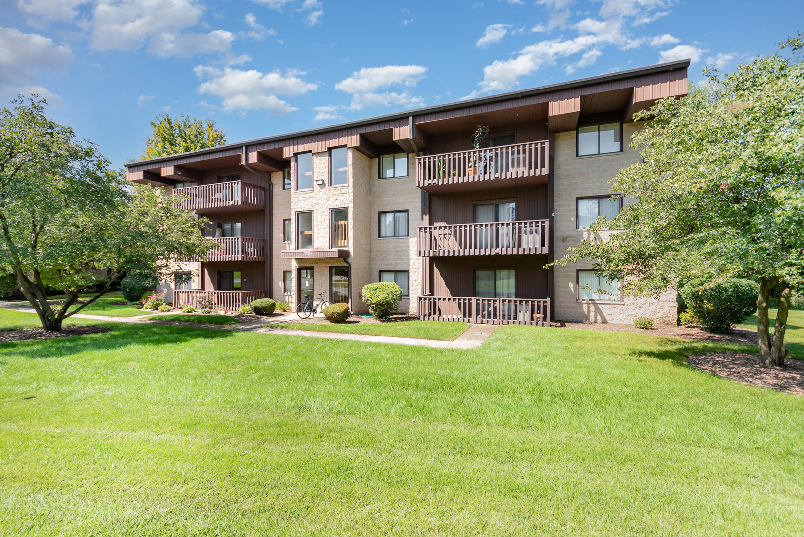 Beautifully re-imaged GROUND LEVEL RANCH end unit backing to the serine nature preserve at Woodland Terrace, just deep cleaned and ready to go, fresh neutral colors throughout, no step/stair climbing required to access the building or unit entry, building is set far back from all road noise and busyness, offers peaceful relaxing views out every window, quality Burla built Flixicore quiet construction, fully updated new in 2022 condo includes a one of a kind eat at kitchen island combining table space and additional storage not found in other units-windows-luxury vinyl plank flooring in living room/kitchen/baths/laundry-tile kitchen backsplash-electrical outlets/recepticals/switches-furniture quality adult height bath vanities with granite tops, new in 2024 microwave and hot water heater, convinient in unit laundry with washer/dryer included, ceiling fans in both bedrooms,water/garbage/basic cable included in monthly HOA, garage space# 68 is very close to unit just 1 bay down from the sidewalk to the unit, large relaxing patio with new outdoor carpet overlooks nature preserve property offering abundant privacy and peacefulness.