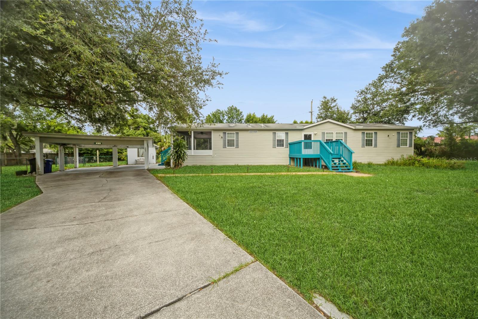 Move-in ready and set on nearly half an acre with no HOA, this spacious 3-bedroom, 2-bath manufactured home offers the perfect blend of functionality and freedom. Built in 2012 and featuring 1,620 square feet of living space, this home boasts high ceilings, a desirable split-bedroom layout, and an open floor plan designed for modern living. The large kitchen is a standout with a center island, pantry closet, and ample cabinetry—ideal for cooking and entertaining. The primary suite includes a walk-in closet and private bath with double vanity and step-in shower. Enjoy indoor-outdoor living with sliding doors that lead to a screened-in porch overlooking the fenced yard, complete with mature trees and space for a boat, trailer, or RV. Recent updates include a new A/C system installed in 2020 and energy-efficient double-pane windows throughout. A two-car carport, workshop, and shed add to the property's versatility. Conveniently located near the Brandon-Alafia River boat ramp and major roadways, this property offers the rare combination of space, privacy, and location—without the restrictions. Best of all, this home qualifies for FHA financing—making it even more accessible for first-time buyers. Don’t miss your chance to make this home your own.