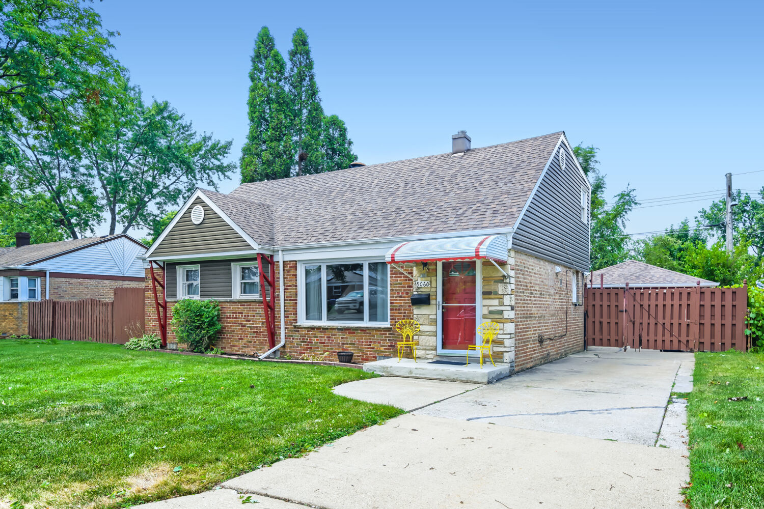 Welcome home to this spacious 3-bedroom, 2.5-bath expanded Cape Cod, perfectly situated on an over-sized Chicago lot in a quiet, desirable Chicago neighborhood.  The main level offers a bright eat-in kitchen, comfortable living room, spacious family room, convenient first-floor bedroom, full bathroom, and laundry room-providing a flexible layout for everyday living.  Upstairs, you'll find two generously sized bedrooms with abundant closet space, a linen closet, and 1.5 bathrooms.  Step outside to enjoy the large deck overlooking a generously sized backyard featuring two separate gardening areas-perfect for entertaining, relaxing, or cultivating your favorite flowers and vegetables. The detached garage includes an attached storage shed and the home also features a cement driveway.  Recent updates provide added peace of mind, including a new roof (house and garage), gutters, and soffits, and house siding (2023), as well as a new living room window (2024) Hot water heater 6 years old.  Conveniently located near schools, parks, shopping, and more, this well-maintained home offers space, comfort, and a wonderful location. Don't miss your opportunity to make it yours!