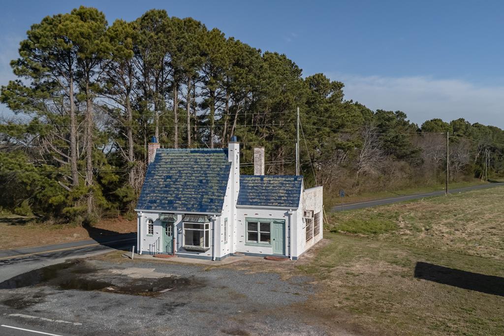 Location Location Location... PRIME COMMERCIAL CORNER Parcel coming into town of Cape Charles. Historic Pur Oil building built in English Cottage style is iconic landmark here on the Shore. Property consists of 3 parcels just under 3 acres. Small billboard included. Building has been vacant for some time. No info available on well/septic. Ask about Historic State Tax Credits and Enterprise Zone.