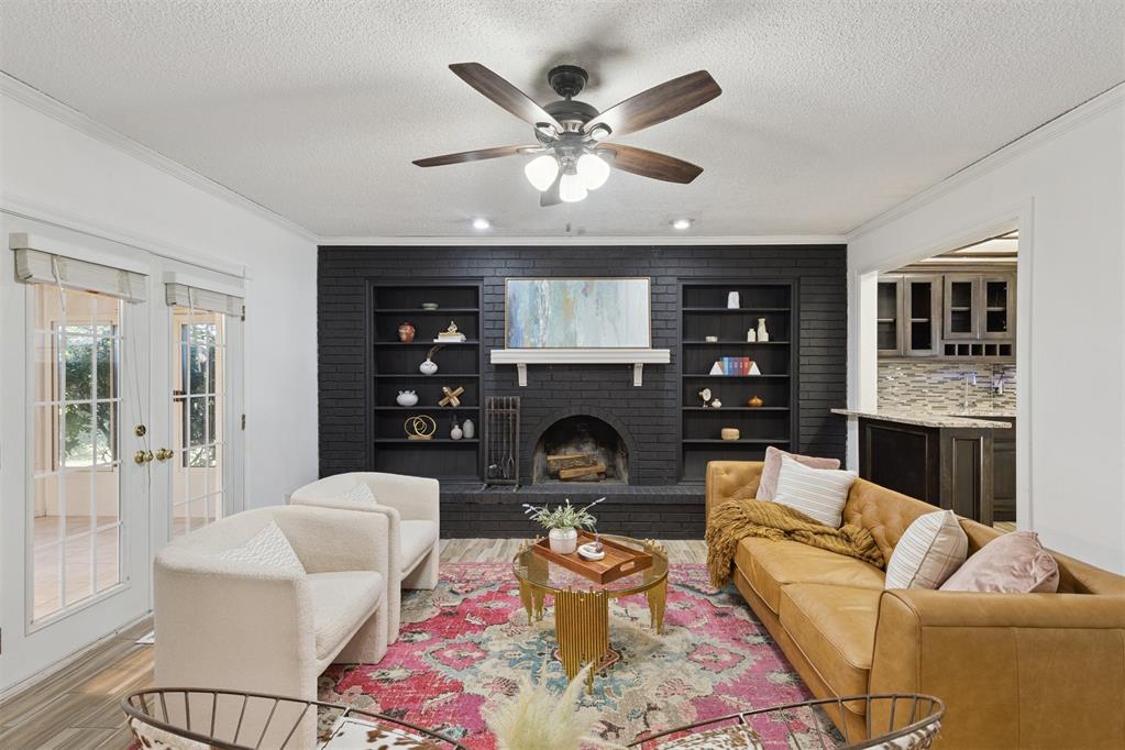 Welcome to 1225 SW 94th St! Tucked away on a quiet cul-de-sac in the established Sky Ranch neighborhood, this extraordinary 5-bedroom, 2.5-bath home offers over 2,700 sq. ft. of comfortable living space on an oversized lot shaded with mature trees. The charming front porch sets the tone, leading into a bright entryway that flows into a versatile living area, perfect as a formal dining room or second living space. Just beyond, a sunken family room with a cozy wood-burning brick fireplace invites you to relax, while French doors open to a cheerful finished sunroom filled with natural light.
The updated kitchen is a dream for both cooking and entertaining, featuring granite countertops, stainless steel appliances, abundant storage and a breakfast bar alongside an additional dining area. A spacious guest bath and laundry room with garage access make the main floor as functional as it is inviting.
The primary suite, conveniently located on the first floor, offers a private retreat with ensuite bath and walk-in closet. Upstairs, four well-sized bedrooms and a large shared bath provide endless options for family, guests, home offices or a personal gym. Generous closets and built-ins throughout the home keep everything organized with ease.
Step outside and discover your own private oasis: a large backyard with paved walkways, raised patio with built-in grill, covered hot tub, play area, tree swing and a tranquil pond, an entertainer’s paradise and family retreat all in one.
With nearby schools, shopping, dining and quick access to highways, this home combines comfort, convenience, and character in a setting you’ll love.
Don’t wait, this rare find in Sky Ranch is ready to welcome you home!