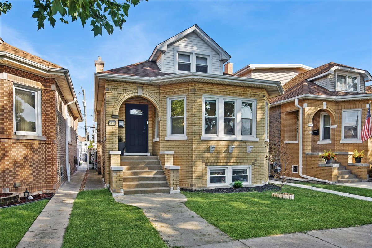 Step into this stunningly updated five bedroom, three full bathroom bungalow in the heart of Portage Park! Designed with both style and function in mind, this home offers bright, spacious living areas perfect for everyday comfort and entertaining. The main level boasts a welcoming living room, a separate dining room, and an impressive kitchen featuring quartz countertops, 42" cabinetry, and brand-new stainless steel appliances. Three bedrooms and a full bath complete the first floor, creating a versatile layout for family and guests alike. Upstairs, the private primary suite is your retreat, showcasing a sleek, modern bathroom and the convenience of laundry hookups. The finished lower level expands your living options with a freshly updated full bath, laundry/utility area, and endless space for a recreation room, gym, or home office. Recent updates include a new water heater, a newer furnace, updated windows, and a newer washer/dryer, giving you peace of mind for years to come. Set in the vibrant Portage Park neighborhood, this home keeps you close to highways, transit, parks, shopping, and dining.