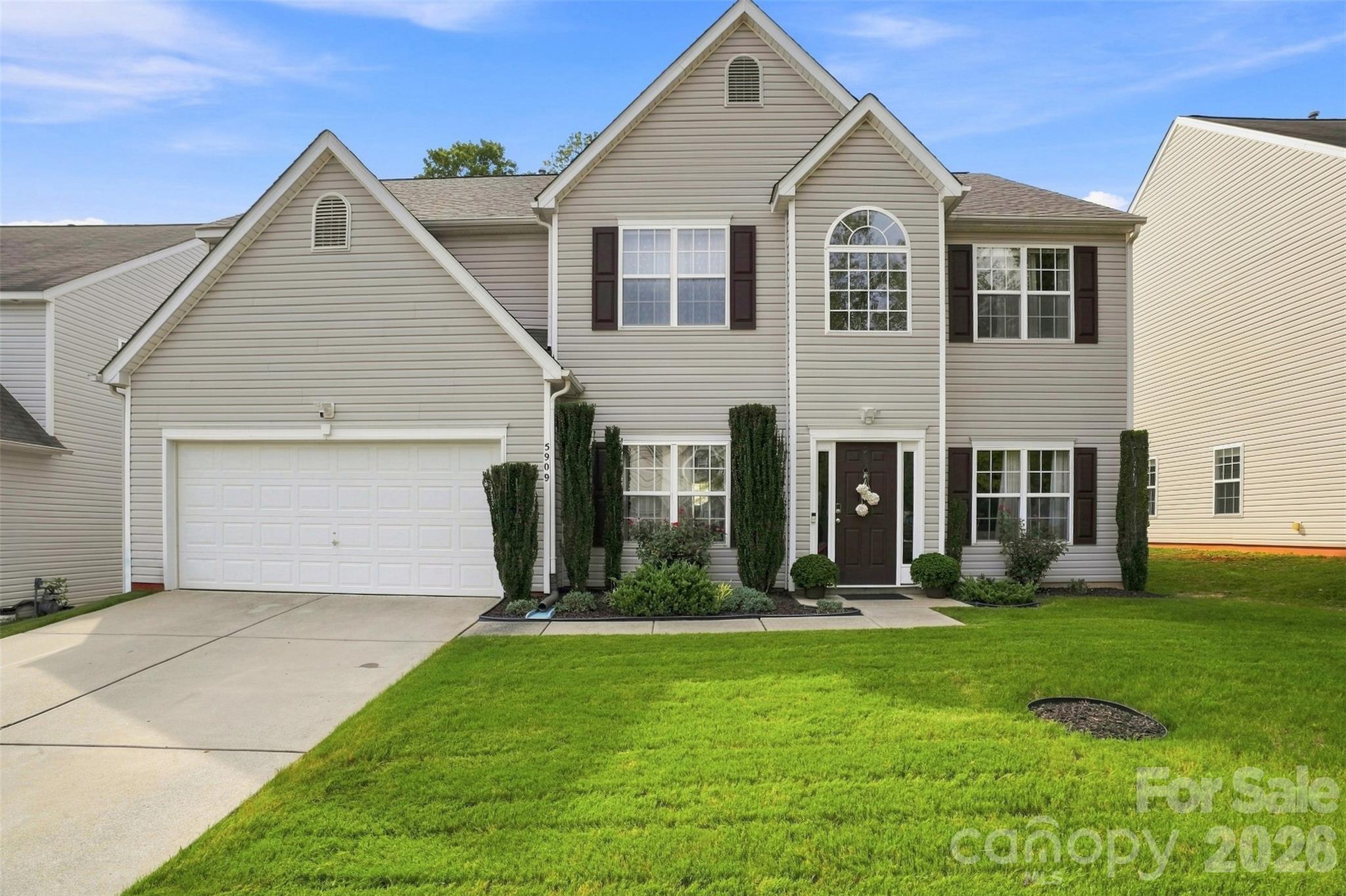 Beautifully updated ONE-OWNER HOME IN MATTHEWS, thoughtfully designed for maximum comfort, functionality, and low-maintenance living. The TWO-STORY LIVING ROOM features abundant natural light and a WOOD-BURNING FIREPLACE. The SHOW-STOPPING CHEF’S KITCHEN features gorgeous new cabinetry, quartz countertops, a HUGE ISLAND WITH WATERFALL QUARTZ, double-oven electric range, apron-front sink, stainless steel appliances, and beautiful new lighting. The main level offers a LARGE DINING ROOM WITH OVERSIZED WINDOWS, spacious office with gorgeous sliding doors, DEDICATED EXERCISE ROOM, and a fully updated full bathroom. Upstairs, the SPACIOUS PRIMARY SUITE WITH VAULTED CEILINGS features a huge walk-in closet with an organization system and a beautifully renovated bathroom with new vanities and tile. Three additional bedrooms also feature VAULTED CEILINGS AND PLENTY OF STORAGE. All bathrooms have been beautifully updated, and HARDWOOD FLOORS THROUGHOUT—NO CARPET! The large laundry room includes a dedicated sink and additional flexible space currently used as a hair salon. Major updates include a NEW ARCHITECTURAL ROOF IN 2024 and NEW WATER HEATER IN 2026. Step outside to a VERY PRIVATE BACKYARD BACKING TO WOODS, featuring a large patio and beautifully manicured landscaping.