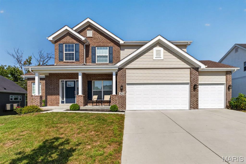 This beautifully appointed 1.5-story home combines generous living spaces, thoughtful upgrades and a setting designed to be enjoyed. From the moment you enter, the home feels bright and inviting, with a spacious 2-story great room framed by a wall of windows, custom lighting and an easy connection to the dining area and foyer. Durable LVP flooring flows through the main living areas, creating a cohesive feel while offering everyday practicality. At the heart of the home, the kitchen delivers both style and function with quartz countertops, a custom tile backsplash, center island, upgraded cabinetry with crown molding, double ovens, built-in microwave, stainless dishwasher, recessed lighting and a walk-in pantry. The adjoining breakfast room adds even more flexibility with custom built-ins featuring glass-front cabinetry and crown molding, plus a slider leading directly to the new composite deck. The main-level laundry room is equally well appointed with built-in cabinetry, marble countertop, wash tub and folding area. Upstairs, the spacious primary suite offers a peaceful retreat with a bay window and dual walk-in closets with custom organizers. The primary bath features a tiled floor, double-sink vanity, walk-in shower, freestanding soaking tub and private commode area. Three additional bedrooms provide generous space and walk-in closets, complemented by a Jack-and-Jill bath and an additional full bath for added convenience. The walk-out finished lower level gives the home another dimension, featuring a large family room with recessed lighting and built-in speakers, a fifth bedroom with walk-in closet and a full bath with walk-in shower. Whether used for guests, movie nights, recreation or simply spreading out, this level offers valuable additional living space. Outside, the fenced backyard and level lot backing to trees create a private setting for outdoor living and entertaining. The new composite deck provides an inviting space to relax or gather, with stairs leading directly to the lower-level patio for easy access between outdoor living areas. A concrete driveway leads to the oversized three-car garage, while an electric vehicle charger adds modern convenience. Zoned HVAC with air purifiers provides additional comfort throughout the home. A versatile floor plan, extensive storage, upgraded finishes and a peaceful outdoor setting come together in a home that offers the space and flexibility today’s lifestyle demands. And when it’s time to venture out, this home puts the best of the Chesterfield area within easy reach, with Chesterfield Valley, premier shopping and dining, parks, and convenient highway access just minutes away.