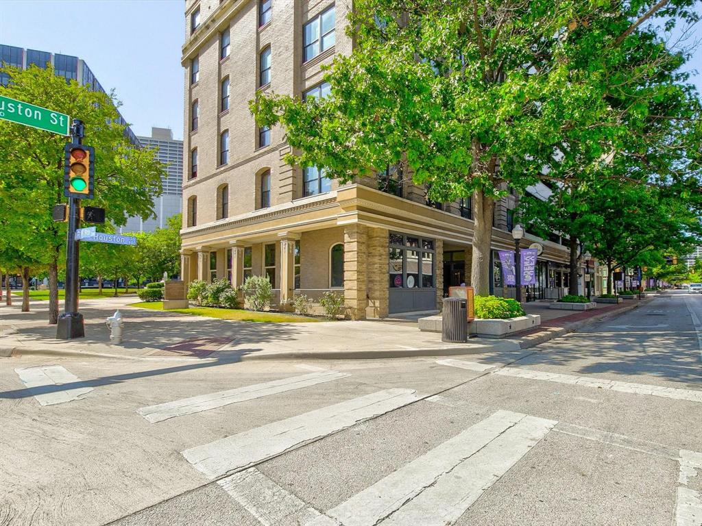Welcome Home to Houston Place Lofts #502! Experience the perfect blend of historic charm and modern urban living in this stunning one-bedroom, one-bath loft located in the heart of downtown Fort Worth. Situated in the iconic Houston Place Lofts, originally built in 1906 as the Western National Bank and converted into a boutique 30-unit condo complex in 2005, this residence offers an unparalleled living experience. Step inside and be captivated by the open-concept design, exposed brick walls, hardwood floors, soaring ceilings with exposed vents, and industrial-style track lighting—all thoughtfully preserved to showcase the building’s rich history. Large windows invite natural light, offering a glimpse of Fort Worth’s vibrant cityscape. Located just steps from Sundance Square, the Fort Worth Convention Center, top-rated dining, nightlife, and entertainment, this loft places you in the center of it all. Enjoy the convenience of two assigned parking spaces in a secure garage — a rare find in downtown living.Whether you're an urban professional or seeking a stylish retreat, Houston Place Lofts #502 is your gateway to the ultimate downtown lifestyle. Water & Internet included in monthly rent.