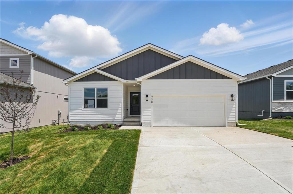 This bright and comfortable three-bedroom, two-bathroom ranch home backing to greenspace features an open layout, abundant natural light, and inviting living spaces perfect for everyday living and relaxed entertaining. The kitchen features a spacious island and a walk-in pantry, thoughtfully designed to keep everything within reach while creating the perfect hub for cooking and connecting with guests. The primary is a true private retreat, complete with an en-suite bathroom and a laundry-connected closet while two additional bedrooms on the opposite side of the home share a well-appointed bathroom. The full unfinished lower level presents endless possibilities to create your dream space with more than enough space for a fourth bedroom, 3rd full bath, rec room and additional storage.  The large low maintenance deck with unobstructed views welcomes evening dining and early morning coffee time.  Eastbrooke at Creekmoor has it all!  Designed around 108 acre Lake Creekmoor and the acclaimed 18 Hole Championship Golf Course, Creekmoor offers one of the most comprehensive residential amenities packages available, where homeowners with both active and relaxed lifestyles enjoy what feels like vacation all year long.  Pools, tennis, pickleball, basketball, 24-hour fitness center, golf pro shop, Tavern on the Moor restaurant and bar, fishing, boating, SUP, and still more...it's ALL here!  With an abundance of shops, restaurants and services minutes away and with easy access to Jackson and Johnson Counties, homeowners have all the benefits of metro living at their fingertips while enjoying home life outside the hustle and bustle. Whether making your first home purchase or your last, this is a destination community like no other.