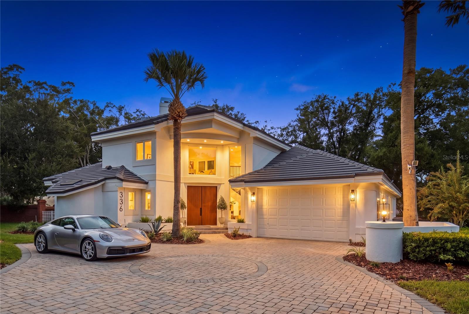 Welcome to Ashford Villa, a one-of-a-kind, masterfully reimagined residence by BRAVO that sets a new standard for design, craftsmanship, and modern luxury in Heathrow. Located within Regency Green, one of Heathrow’s distinguished custom-home enclaves, this exceptional pool home delivers a level of architectural detail, material selection, and curated finish rarely found in the community.Offering 4 bedrooms, 5 bathrooms and over 3,000 square feet, this residence has been transformed into a striking showcase of elevated living. New custom tempered, energy-efficient windows fill the home with natural light, highlighting soaring 22-foot ceilings and an open-concept design that still provides a thoughtful sense of separation and privacy.The great room is framed by relaxing pool views and flows effortlessly into the heart of the home: a bespoke D’Nook-designed gourmet kitchen created for both daily living and entertaining. Features include a refined center island, custom soft-close cabinetry, premium Thermador and Bosch appliances, dramatic countertops, and a handcrafted curved Venetian-plaster range hood. An integrated Scullery adds exceptional prep space, storage, and functionality.The living area is anchored by a custom fireplace with distinctive hand-troweled finishes, creating a warm, tranquil setting for intimate gatherings and larger-scale entertaining. Throughout the residence, curated materials, contemporary finishes, and artisan details establish a calm and polished ambiance.The owner’s suite is an expansive private retreat of more than 600 square feet, complete with a coffee station, wine refrigerator, fireplace ,walk-in closet, dual vanities, and a spa-inspired bath. The luxurious bath features a custom curved shower, freestanding soaking tub, and designer finishes that create a truely disctinctive luxury experience.Three additional bedrooms and bathrooms provide exceptional versatility, including an integrated upstairs guest suite that is ideal for guests, multigenerational living, or a private office. Outside, the covered rear porch and pool area create a private setting for relaxed evenings and weekend entertaining.Major improvements provide exceptional peace of mind, including a new tile roof (2025), custom upgraded tempered windows and front door (2026), Pool Resurface & patio (2026) , HVAC (2026) , WH (2026) and more.Residents enjoy 24-hour manned gate security, community parks and playgrounds, and optional country-club memberships offering golf, tennis, fitness amenities, and a resort-style pool. Convenient access to I-4, SR-417, and the Wekiva Parkway provides an ideal combination of Heathrow luxury and Central Florida connectivity.