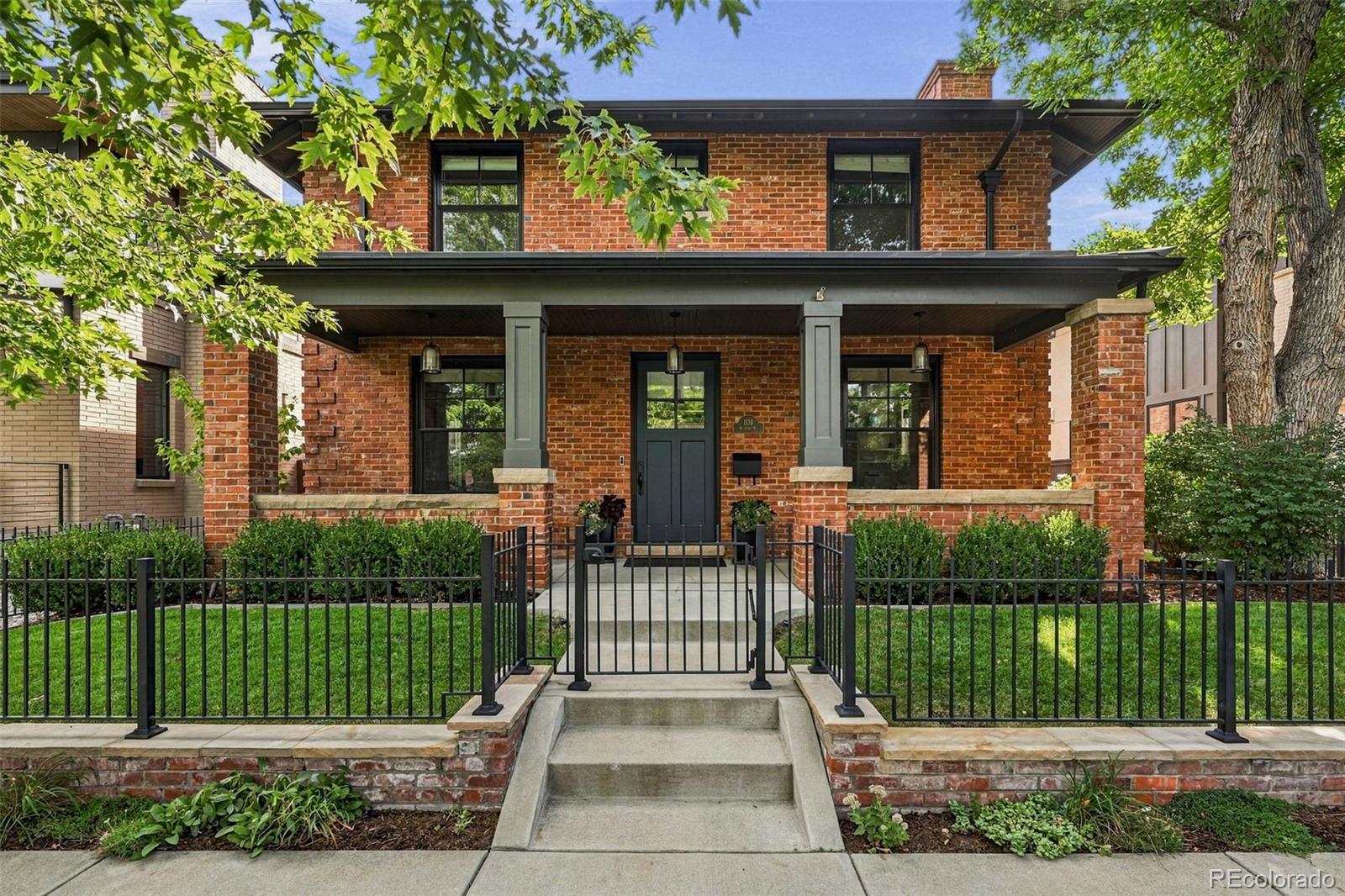 Exceptional design meets modern luxury in this custom 2010 masterpiece by Chalet. This Wash Park home seamlessly blends historic Denver charm with modern luxury, featuring an exterior crafted from repurposed turn-of-the-20th-century brick and an interior boasting exquisite custom millwork throughout. The main floor is designed for effortless living and entertaining, featuring an amazing private study with a fireplace, a formal dining room, a butler’s pantry, and a large, open family room with a second fireplace. The chef’s gourmet kitchen is equipped with premium Thermador appliances. Upstairs, the second story hosts four bedrooms, including an ensuite guest room and a luxurious primary suite complete with a massive walk-in closet and heated tile floors. The finished basement adds two more large bedrooms, a modern-rustic bath, an expansive entertaining space, and ample storage. A standout feature is the detached, oversized 2-car garage and back house, fully equipped with central heating and cooling. This versatile space includes a large flex area perfect for a private home office, gym, or extra storage. Outside, the property features a fully fenced yard with a custom wrought iron front yard fence, a built-in firepit, and professional landscaping. Situated in Washington Park, you are just one block from the vibrant dining and shopping on Old South Gaylord and local favorites like Wash Park Social. You do not want to miss this rare opportunity!