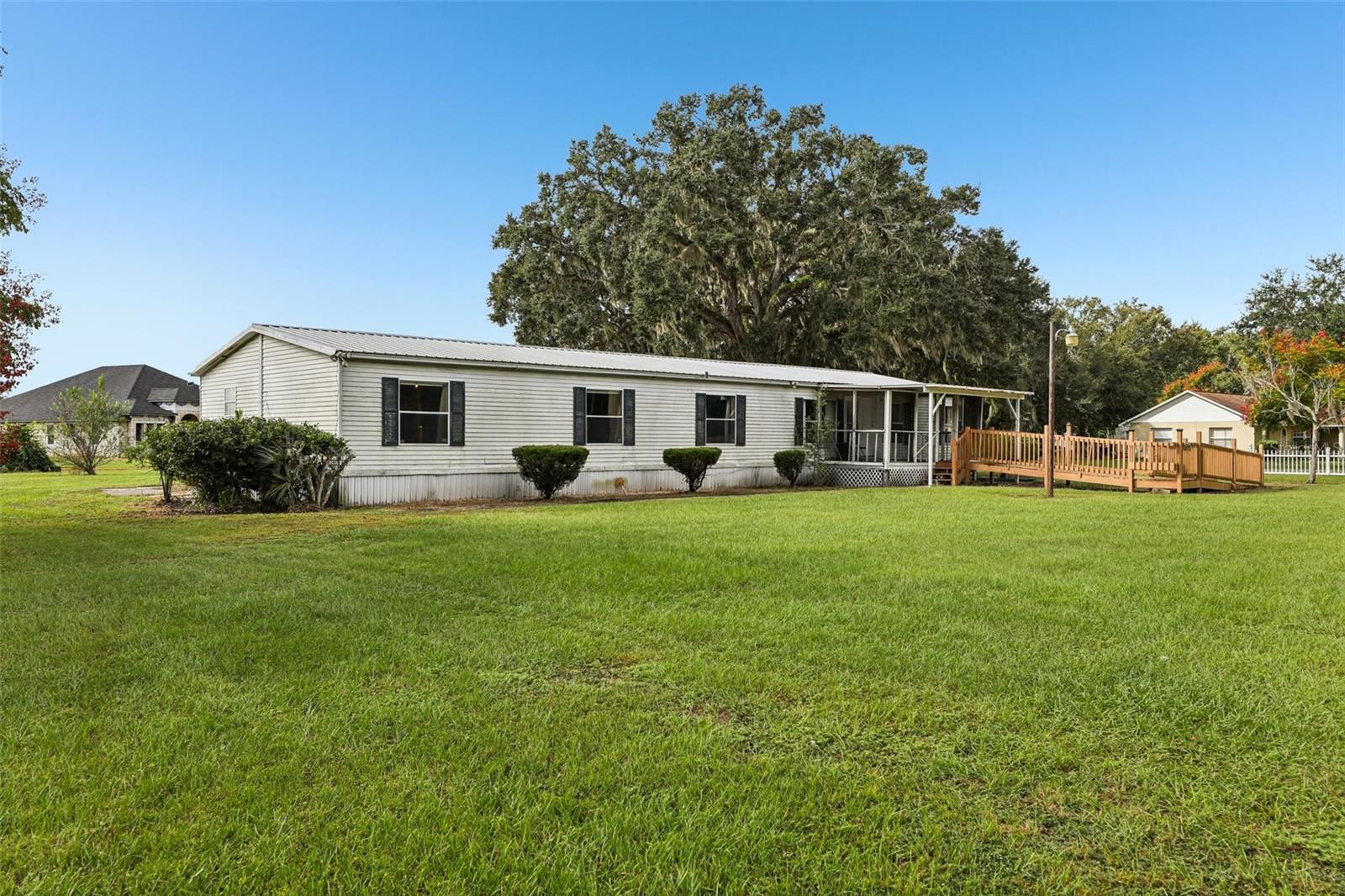 Great country home at a fantastic price! This spacious 4-bedroom residence sits on nearly an acre with no HOA, offering freedom and privacy. Inside, you’ll find over 2,000 square feet of living space, a convenient inside laundry room, and a flexible 4th bedroom that could serve as a home office or cozy den. The primary suite boasts a large en suite bath with a garden tub and separate shower. A newer metal roof provides peace of mind, while the additional 30' x 10' screened porch opens up endless possibilities—it could become an outdoor kitchen, a garage, or a carport. With plenty of room for large or extended families, this property is perfect for anyone who wants space to spread out. With a little TLC, this home would be a fantastic buy! Close to major roads for easy commuting and right across the street from Leesburg Bike Trail which shows a beautiful view of old Florida growth trees. This property does need a new well, but that’s an opportunity to make it your own. Call today for details—this one won’t last!