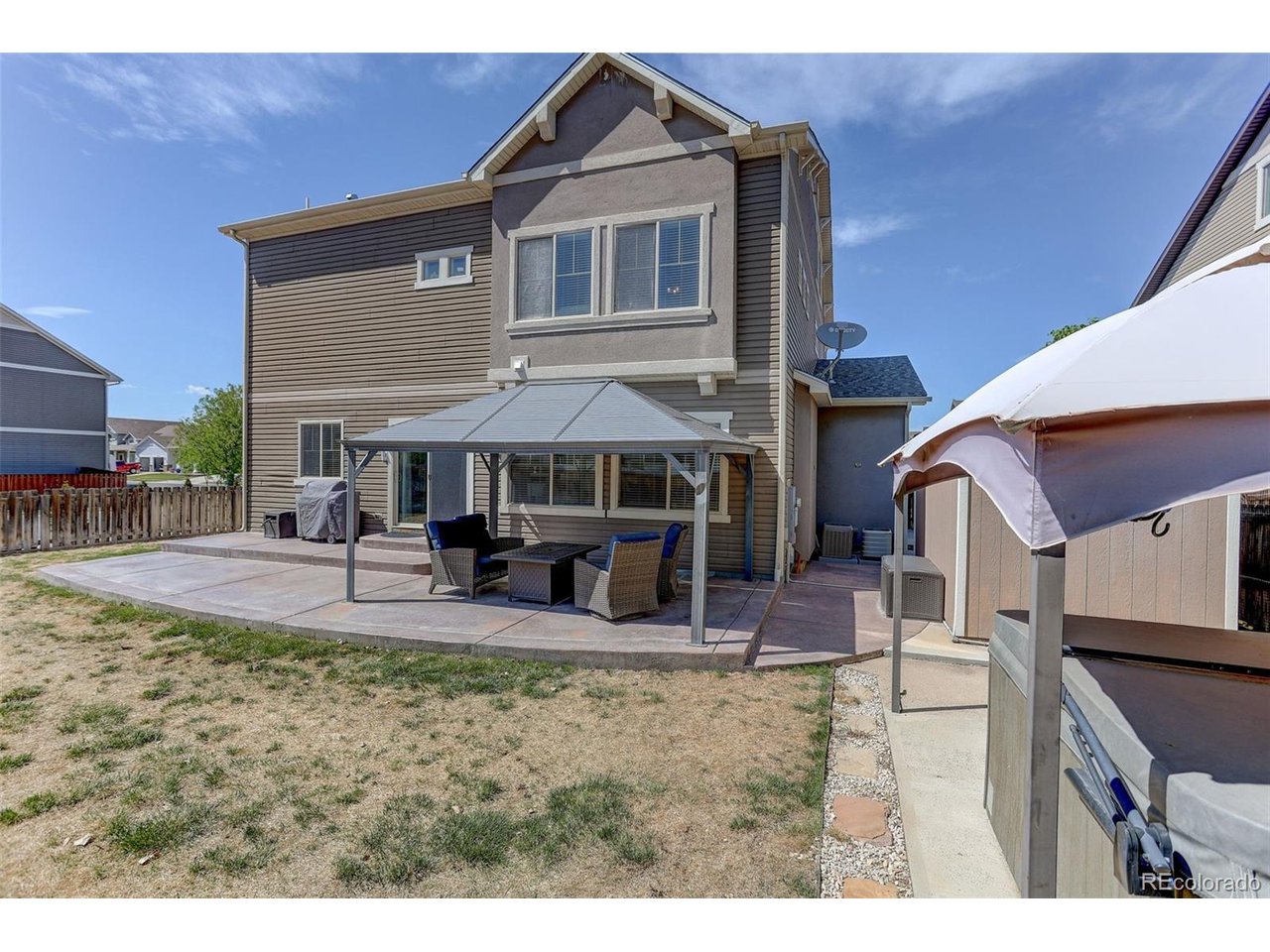 Prepare to fall in love with this exceptional home in the highly desirable Stillwater Subdivision, where luxury, technology, and functionality meet. This one-of-a-kind, three-story residence offers over 5,000 sq ft of refined living space on a premium corner lot, complete with a 3-car garage and fully integrated smart home features.Step inside to an elegant formal living area that flows seamlessly into a beautifully updated kitchen featuring 42-inch cabinetry, quartz countertops, a stylish tile backsplash, and smart stainless steel appliances. The inviting family room showcases a striking electric fireplace. Enjoy enhanced living with built-in surround sound and upgraded can lighting for both bright and ambient settings.This home is loaded with high-end upgrades including a central vacuum system, dual furnaces and an A/C unit, Google Nest thermostats, and a Ring camera system covering the front door, driveway, and backyard. The garage is equally impressive, featuring a 220-volt outlet ready for EV charging or additional appliance use.Step outside to your oversized concrete patio, two pergolas, a clean and fully operational hot tub, and full fencing, perfect for relaxing or hosting unforgettable summer gatherings. Exterior lighting on smart switches enhances both ambiance and security.Conveniently located with easy access to Hwy 85, I-76, and E-470, this home truly has it all. Schedule your private showing today and experience elevated Colorado living at its finest.