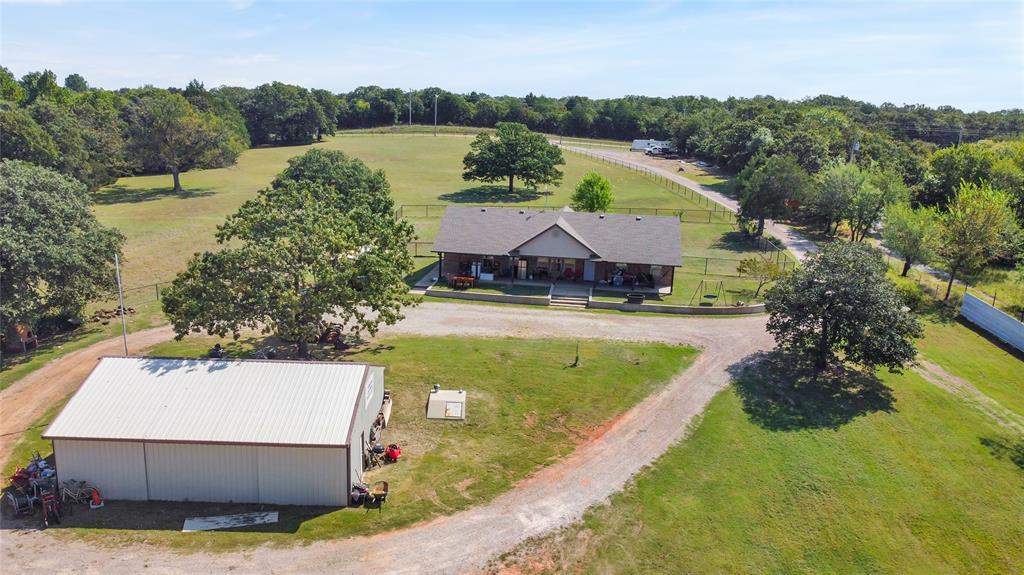 Discover your dream home on this pristine 10-acre retreat. This property offers a perfect blend of peaceful country living and modern comfort. The home features beautiful wood-look laminate flooring and a chef's kitchen with a spacious pantry and extensive counter space. A large utility room with ample storage adds to the functionality of the home.

The fully fenced grounds are home to beautiful wildlife and are situated in a welcoming community with amazing neighbors. The property includes a 30x40 shop with a concrete slab, electricity, and two sliding barn doors, as well as a 53x42 barn with a loft and three easily convertible stalls. For your safety, a storm shelter is also on site.

Key updates include a 2024 roof, a 2022 hot water tank, and a 2016 CH&A system.