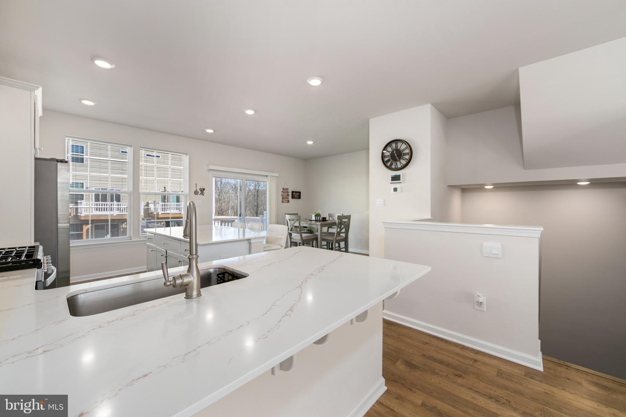 Welcome to 472 Monte Farms Road!  Location, location, location, the front of this property offers a beautiful view of trees-it is beautiful!  The convenience of luxury townhome living meets the amenities and spaciousness of a single-family home.  This stunning almost new home built in 2024 is an open concept home with 2,290 square feet of living space, 3 bedrooms, 3.5 baths and a 2-car garage situated in The Gables is just minutes from Interstate 295, Routes 38, 73 and 70, local dining, shopping venues and top rated schools! The main level, featuring 9 ft. ceilings has a large bright living space, which is open to the spacious kitchen and eating areas, with a large modern island, providing plenty of additional storage and room for cooking and entertaining. Off the dining room you will find a 12x10 composite deck to enjoy the outdoors & beautiful sunrise at breakfast! The upper level boasts 3 bedrooms, a hall bath and the convenience of an upstairs laundry room. The owner's suite features a large walk-in closet and owner's bath with a luxury shower. There is a finished lower-level rec room (similar to an above-ground, walkout basement) which could make a great entertainment room, home gym or office --- the options are endless! The kids and dog can play out back in the fenced yard.  This home comes complete with a Smart Home System featuring a Qolsys IQ Panel, Honeywell Z-Wave Thermostat, Amazon Echo Dot, Skybell, Eaton Z-Wave Switch and Kwikset Smart Door Lock.  Don’t miss your opportunity to own this exceptional home—schedule your showing today and see why 472 Monte Farms Road is the perfect place to call home!