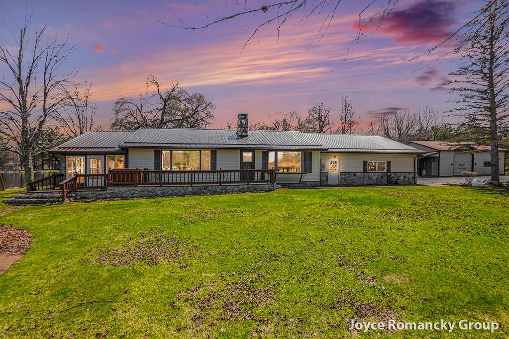 You have been looking for this lakefront property! Tucked away on the quiet shores of Halls Lake, this rare offering delivers the peace, privacy, and panoramic water views you have been dreaming of, whether as a year-round residence or a perfect getaway retreat. Sitting on 2.4 acres with over 500 feet of private water frontage, this property is one of a kind. Halls Lake is not an over-populated lake. Its wooded surroundings serve as a natural preserve, keeping the atmosphere serene and uncrowded. To the east, a watershed conservatory borders the property, ensuring no future neighbors and even greater seclusion. Direct water access makes boating, fishing, and lakefront relaxation part of everyday life, with unmatched views of the water and breathtaking sunsets right from your own shore. Inside you will find a 2-bedroom, 2-bathroom home with a nicely sized kitchen with ample storage. The stunning double-sided wood-burning stone fireplace anchors the living space, with a beautifuldecorative waterfall built into its end -- a truly one-of-a-kind feature.  A large family room and four-season entertaining space complete the main living areas. Wind down in the private sauna or soak in the hot tub after a day on the water. A whole-home backup generator provides complete peace of mind in any weather. The pole barn offers generous storage for all your recreational gear and watercraft. The natural beauty surrounding this property extends far beyond the shoreline. The Hall's Lake Natural Area covers 175 acres of protected land to the north and east, preserving the wooded landscape for generations to come. Just 9 minutes away, the 100-acre Bundy Hill Preserve is a hidden gem -- hike the ridge trail to a stunning overlook of the valley below. The preserve protects the highest point in Isabella County and the surrounding hardwood forest buffer. This is four-season living at its finest. Despite the total sense of seclusion, everyday conveniences are well within reach -- just 21 minutes to Mount Pleasant, 35 minutes to Big Rapids,