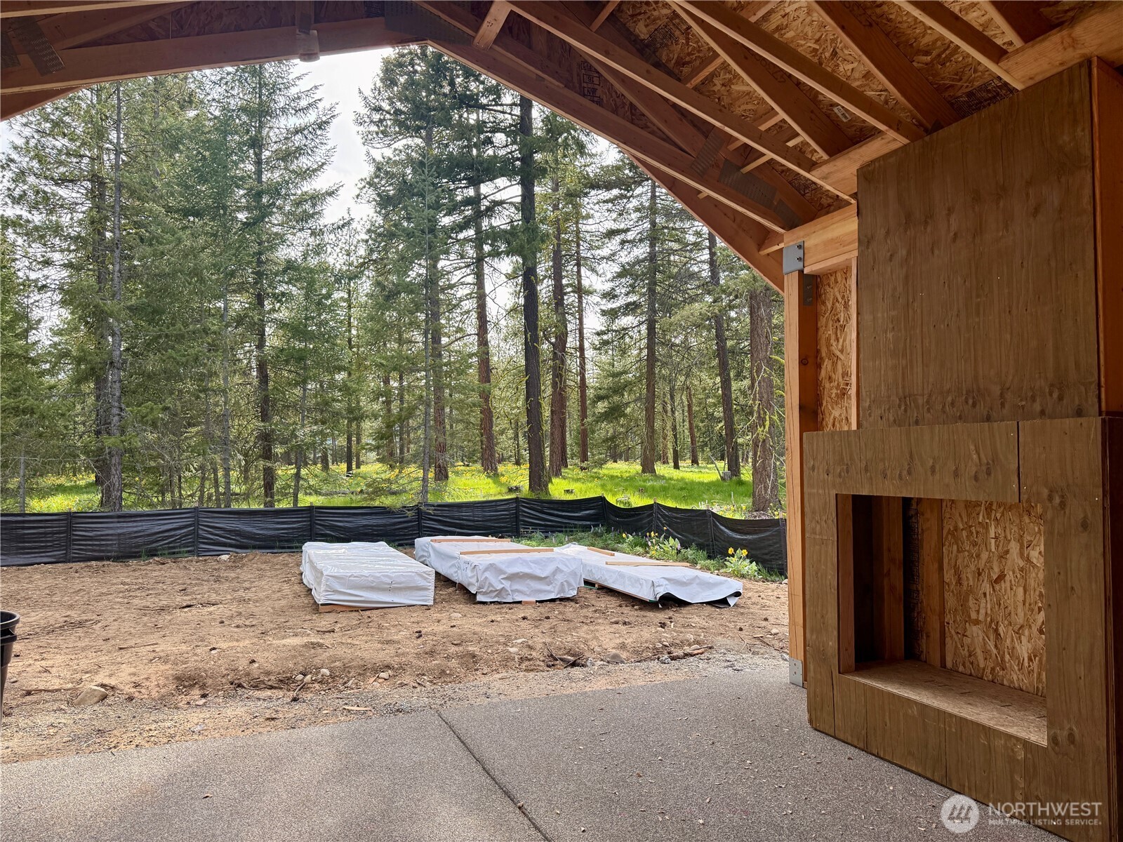 covered rear patio with fireplace.