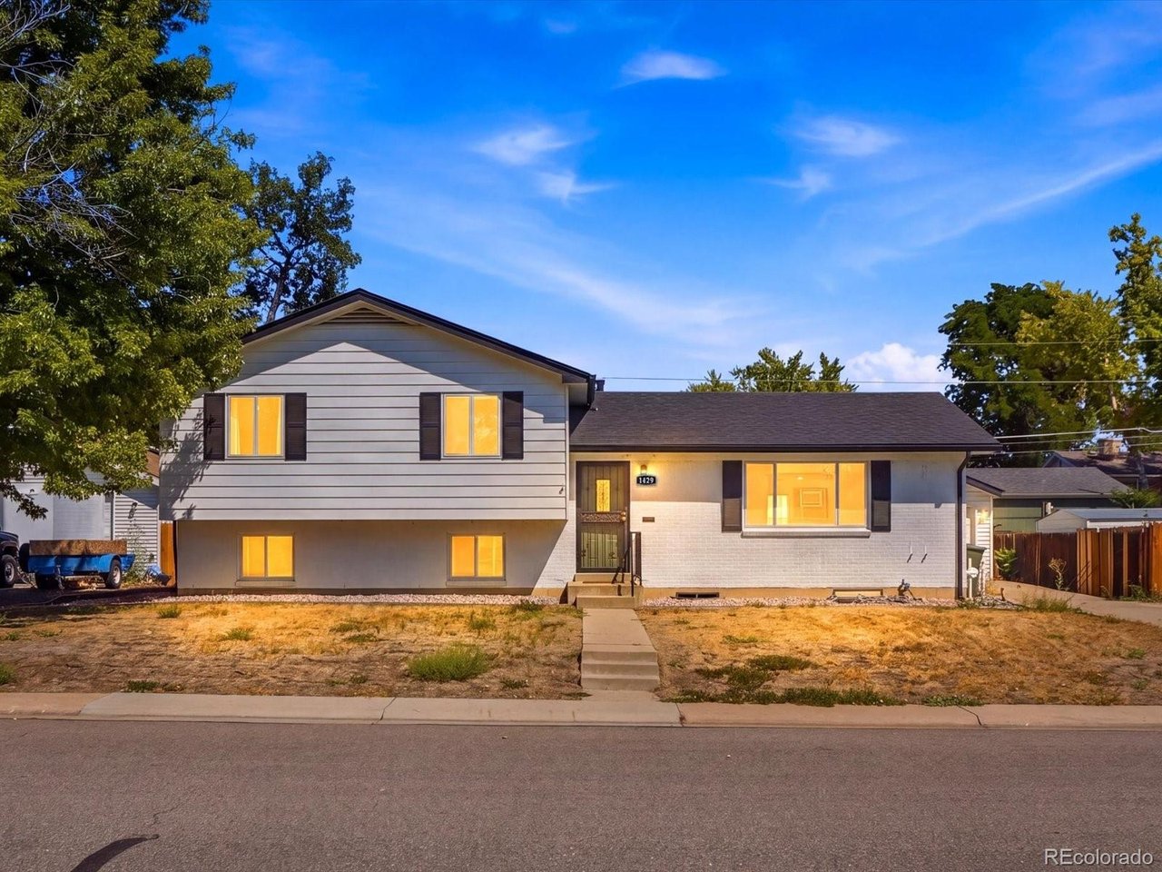 Split-level charm in the heart of Northglenn G. This 4 bedroom, 3 bathroom home offers 1,968 finished square feet on the main and upper levels, plus a 550sf basement with workshop and utility space ready for your finishing touches. A new roof was installed just two years ago, and extensive renovations and upgrades throughout have brought the home's effective age to 1984. An eat-in kitchen anchors the main level, while the upper floor holds all four bedrooms including a primary suite with its own 3/4 bath. Down a level, a versatile den and half bath give you a second living space, home office, or guest setup. Step outside to a fenced 0.18 acre backyard with a detached 2-car garage and a storage shed, plenty of room to garden, entertain, or just spread out. Zoned for Malley Drive Elementary, Northglenn Middle, and Mountain Range High School, with quick access to I-25 and everyday shopping.  Target is .7 miles, King Soopers 1.8 miles, Walmart 3.9 miles, Factory Outlet Mall 3.6 miles.