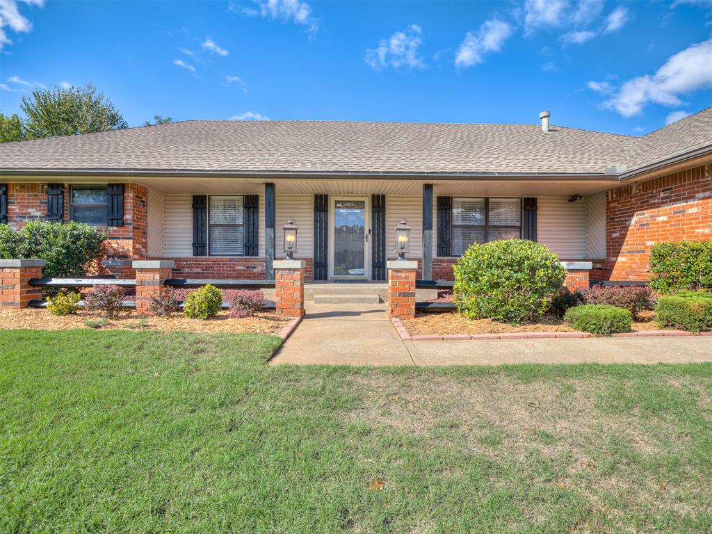 Welcome to Eagle Crest, an established Edmond neighborhood with mature trees, beautifully maintained homes, and inviting streets. With its classic brick exterior, black-stained cedar porch posts and shutters, and lovely landscaping, this 4-bedroom home makes a wonderful first impression.Inside, the living room features a cathedral ceiling, wood-burning fireplace with gas starter, and a built-in bookcase that adds character to the space. Just beyond, the sunroom offers approximately 200 additional square feet MOL not included in the home's listed square footage, with a window A/C unit for added comfort. It's a lovely spot for morning coffee, a collection of houseplants, or simply enjoying a little extra space to unwind.The kitchen has a pretty combination of soft grays and whites, along with plenty of functionality. A gas stove with a split double oven and walk-in pantry make everyday cooking easy, while the adjoining breakfast room features a lovely bay window and a wood plank accent wall that adds warmth and texture to the space.The bathrooms have some of my favorite details in the house! One features a rich, deep blue color-drenched design, while another has beautiful floral wallpaper that adds just the right amount of personality. Plumbing was rerouted overhead in 2025, an important update that's already been taken care of.With four bedrooms, inviting living spaces, and a convenient location with easy access to multiple highways, this Eagle Crest home has a lot to love.