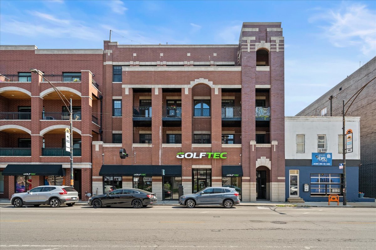 Step into this beautiful 2-bedroom, 2-bath condo in the heart of Lakeview! Located in an intimate, boutique elevator building, this home seamlessly blends timeless craftsmanship with modern comfort. As you enter, you're welcomed by an open-concept living and dining space featuring beautiful hardwood floors and a gas fireplace framed by custom built-ins, which flows seamlessly onto the oversized private balcony. The chef-inspired kitchen is both stylish and functional, featuring granite countertops, stainless-steel appliances, a wine fridge, and under-cabinet lighting. The thoughtful layout allows you to cook, host, and connect effortlessly with guests. The luxurious primary suite boasts 10-foot ceilings, a massive custom walk-in closet, and a spa-like ensuite bathroom complete with a double vanity and glass-enclosed shower. The generously sized second bedroom offers flexibility for guests, a home office, or a workout space, and the second full bath is elegantly appointed for both residents and visitors. One heated garage parking included for ultimate convenience year-round. Located close to the lakefront and the Diversey Brown Line stop, this home offers effortless access to everything you love about city living while being nestled on a vibrant stretch of Halsted lined with cafes, boutiques, and restaurants.
