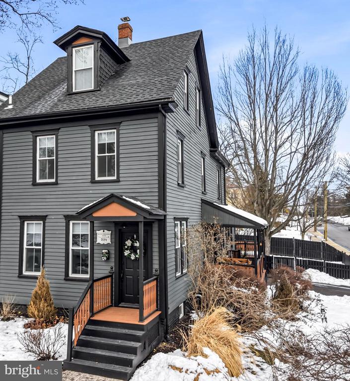 TURN KEY! Move right in to this beautifully restored piece of Moorestown history — a true showstopper renovation by local interior designer Hope Filled Spaces LLC. This home seamlessly blends preserved Victorian character with a modern Art Deco aesthetic, offering custom finishes, thoughtful functionality, and elevated style throughout.Originally built in the late 1800s and once known as the William H. and Hannah B. Irelan House during Moorestown’s period of Victorian growth, this residence has been meticulously reimagined to honor its past while embracing today’s open-concept living.Situated on a charming corner lot just one block from Main Street, this 4-bedroom, 2.5-bath home offers over 2,000 square feet of beautifully designed living space. Enter from Prospect Avenue and unwind on the welcoming side porch with a swing — the perfect place to gather with neighbors or relax at the end of the day.Inside, bright, open living areas are anchored by luxury vinyl plank flooring, custom millwork, wainscoting, and designer lighting. The spacious kitchen is designed for everyday living and effortless entertaining, featuring Bosch appliances, abundant custom cabinetry, two pantries, and a sun-filled dining nook with built-in banquette seating and hidden storage.The adjacent family room highlights original exposed brick, custom built-ins, and a cozy electric fireplace, with seamless sightlines to the kitchen for easy hosting. A beautifully designed mudroom with custom cabinetry connects conveniently to the laundry room and half bath — ideal for busy lifestyles. A versatile first-floor bonus room with French doors offers flexibility as a home office, playroom, guest room, or potential fifth bedroom.Upstairs, three generously sized bedrooms provide ample closet space. At the end of the day, retreat to the private primary suite featuring distinctive paneling, custom built-ins, and a spa-inspired bath complete with a soaking tub, glass-enclosed shower, floating double vanity, and smart toilet, simply stunning!Outdoor living is just as inviting, with two decks off the kitchen perfect for al fresco dining and cozy firepit evenings, all overlooking a fully fenced backyard.  There is also a large basement that offers extensive storage. Located within the highly regarded Moorestown School District and just moments from parks, shops, dining, Memorial Field, and the vibrant events along Main Street, this home delivers both lifestyle and location — walk to everything without worrying about parking.For added peace of mind, the renovation was completed in accordance with township regulations, architectural drawings are available, and a one-year home warranty is included.This is more than a home — it’s a rare opportunity to enjoy historic charm, modern design, and everyday practicality in one of South Jersey’s most sought-after communities.