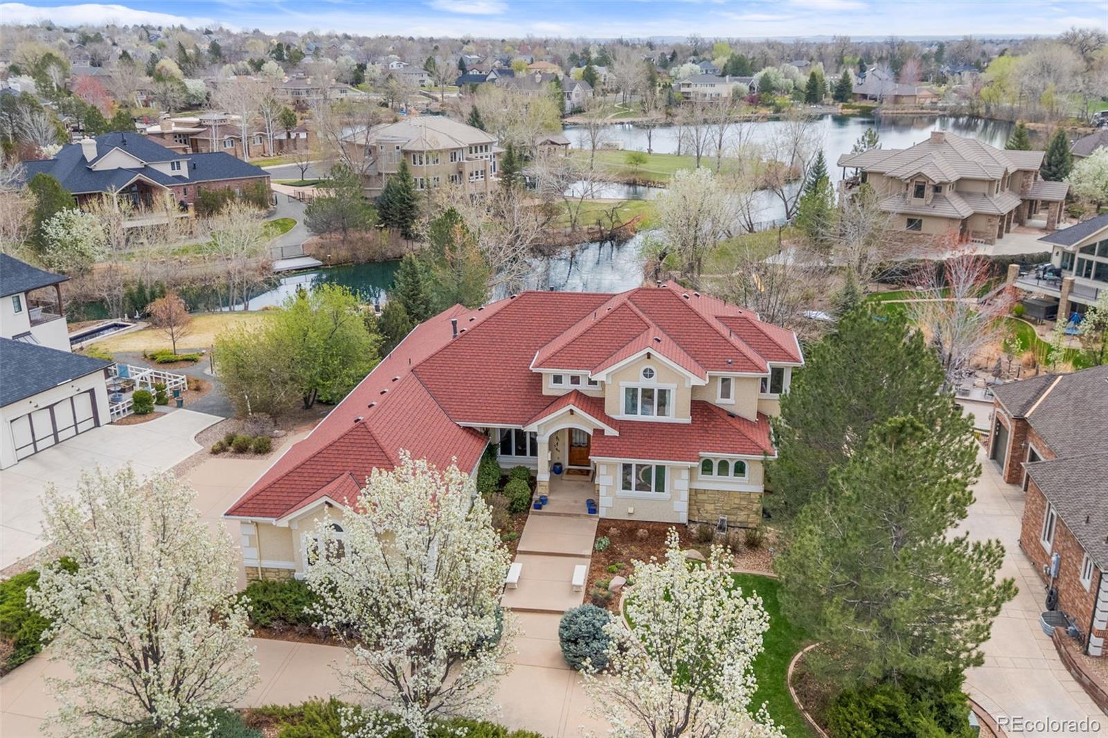 This beautiful CUSTOM LAKEFRONT home is located in the coveted neighborhood of Lake Avery Estates. The home has stunning curb appeal, featuring a circular driveway, stucco and stone exterior, and wide walkway leading to the front porch and a custom arched wood, glass, and iron front door. Spectacular views of the lake are all throughout the home. Mexican travertine flooring covers a majority of the main level.  The curved staircase features a professionally painted custom two-story mural.  The family room fireplace is surrounded in limestone from floor to ceiling. This 3 bedroom, 3.5 bath home has a full basement ready to be finished.  Outside, you will enjoy an expansive wrap-around deck with gas connection, lakeside patio, and gas-lit stone firepit with seating.  Minutes from the Eastlake light rail station and an easy commute to Downtown and the Airport.