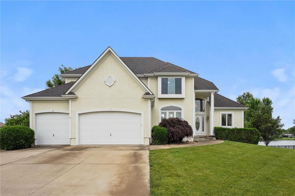 Welcome to this stunning custom-built, one-owner home offering over 6,000 square feet of living space, situated on a prime corner lot with breathtaking lake views. This Move in ready 1 1/2 story home boasts 6 bedrooms, 4 1/2 baths, and a 3-car garage. The main level is designed for both elegance and functionality, featuring extensive built-ins, a see-through fireplace, and expansive floor-to-ceiling windows. The kitchen, hearth room, and dining room showcase beautiful hardwood floors, while the spacious Master Suite offers a serene retreat, The walk-out lower level is perfect for entertaining with a large family room and wet bar, plus 2 offices, a full bath, and an additional bedroom. Upstairs, you will find a versatile loft space and 3 generously sized bedrooms, each with access to 2 full baths. Seller has updated the following in 2025: Carpet, interior paint, refreshed hardwoods and new appliances! This Raintree is a must see!!