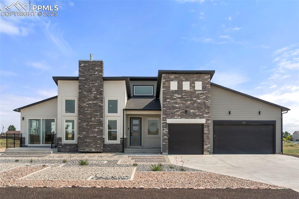 Introducing this Modern Masterpiece in Pueblo West! Brand NEW, MODERN landscaping and extended concrete patio! This stunning new build offers a unique ranch floor plan on a full finished basement with 4 spacious bedrooms and 3 full bathrooms. Boasting tall ceilings and an abundance of natural light, this home creates an inviting and airy atmosphere. Revel in the chef’s kitchen, complete with a large walk-in pantry, solid surface countertop with waterfall ends and high-end stainless steel appliances; gas stove with double ovens, additional wall oven/microwave combo, and a convenient pot filler above the range. Entertain in the vast dining space or have a seat at one of two islands. The expansive primary suite and bathroom features a huge closet with an island, perfect for your wardrobe needs, spa-like walk-in shower and double vanity sinks and a patio door. Enjoy seamless indoor-outdoor living with two patio doors leading to private outdoor patios from the dining space. The full finished basement is an entertainer’s dream, equipped with a wet bar, a massive recreation room with gas fireplace, two additional large bedrooms, full bath and two mechanical/storage rooms. Nestled on a 1-acre lot, this home offers privacy and space without the constraints of an HOA. Additional highlights include A/C, an oversized 3-car garage, set-up for central vacuum, and the peace of mind that comes with a never-been-lived-in property. Experience luxury and modern living in this exceptional Pueblo West gem!