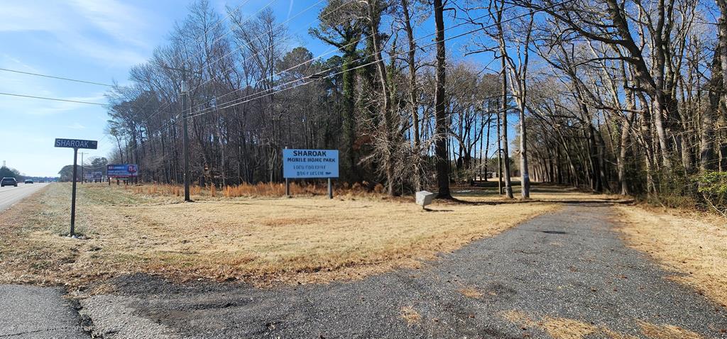 Prime Development Opportunity on Lankford Hwy. Positioned along the high-visibility business corridor of Lankford Highway in New Church, VA, this 7.24-acre parcel offers a rare, fully approved mobile home park with significant infrastructure already in place. The property is approved for 18 mobile home lots, featuring two wells with water mains run throughout the park, new electric hookups for all 18 lots, and nine 4-bedroom septic systems already installed. An additional barn on the property provides flexible use for storage, maintenance, or future operations. With major approvals secured and substantial upfront development costs already completed, this is an exceptional opportunity for investors or operators seeking immediate and scalable income potential in a growing Eastern Shore.