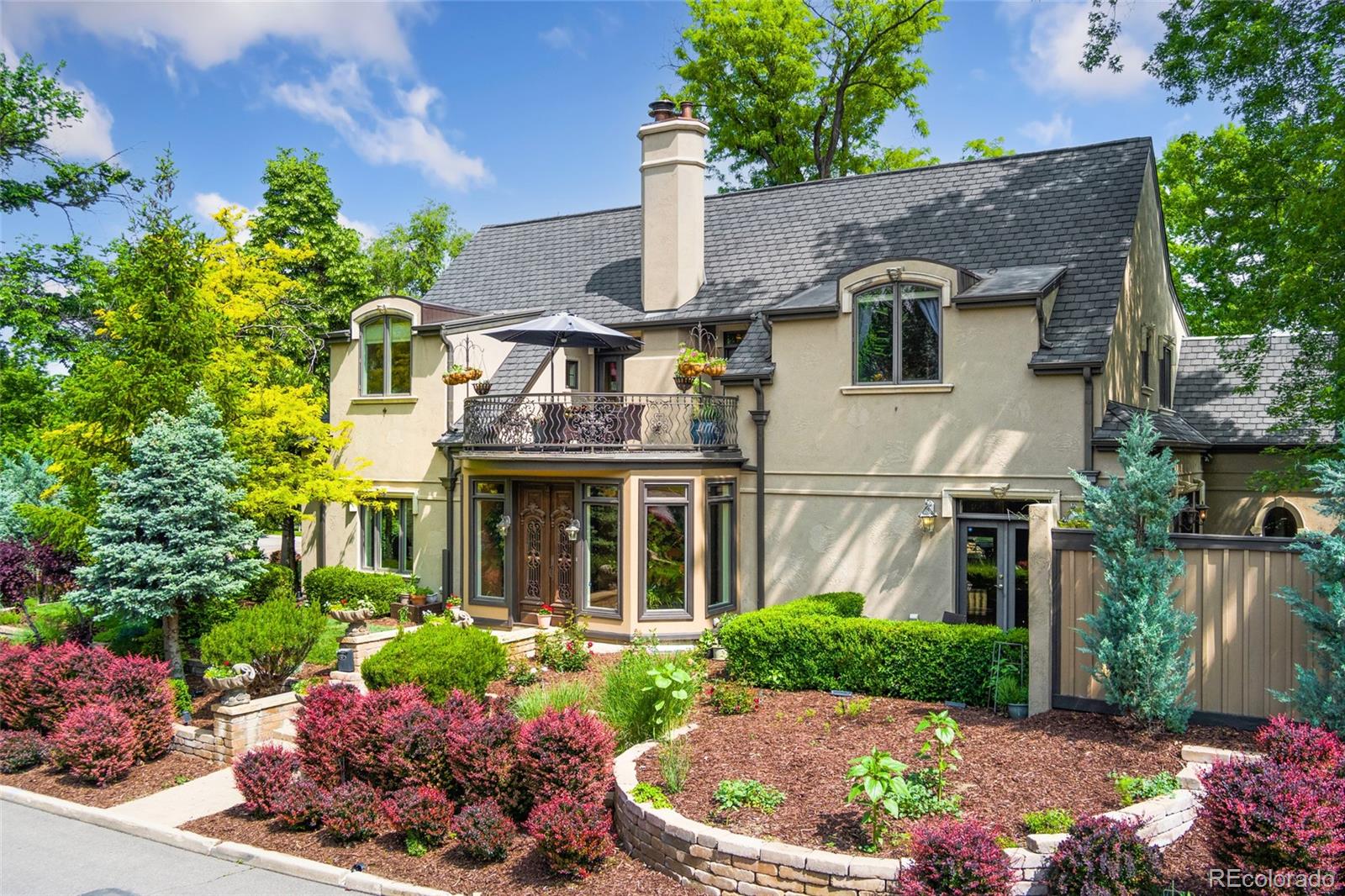 An architectural masterpiece in the heart of Montclair, this one-of-a-kind custom home overlooks historic Montclair Park and blends modern design with timeless charm. Originally built in 2005 and thoughtfully rejuvenated inside and out, this stunning residence showcases exquisite details like imported entry doors from Italy, antique French doors in the primary suite, and original newel post lamps. The flexible and expansive floor plan is perfect for both casual living and formal entertaining, featuring high ceilings, a wood-burning fireplace, and a gourmet kitchen with marble and granite counters, a custom center island, top-tier appliances, and skylights that fill the space with natural light. The luxurious primary suite is a private sanctuary with 12-foot ceilings, a gas fireplace, a spacious five-piece bath, walk-in closet, French doors leading to a newly refinished oversized balcony with park views, and a private study or nursery. Upstairs, two additional bedrooms share a Jack-and-Jill bath, one with a hidden playroom and storage area. The finished basement offers a media room, recreation space, ¾ bath, and a future wine room or sauna. Outside, enjoy professionally landscaped grounds with multi-zone irrigation, serene patios, and a generous two-car attached garage. Numerous recent updates include window well covers (2023), updated garage door unit and sensors (2022, 2025), refreshed landscaping and garage (2025), fully restored interior paint (2024), exterior trim and door restoration (2023), digital thermostats (2021), radon system with crawl space encapsulation (2013), and recently serviced HVAC systems. Interior upgrades include a new KitchenAid dishwasher (2024), antique pantry and armoire, mudroom closet, luxury vinyl flooring (2024), and a new composite deck (2024). Ideally located with a fire hydrant on the corner and a fire station just two blocks away, this truly exceptional home offers the perfect blend of history, elegance, and peace of mind.
